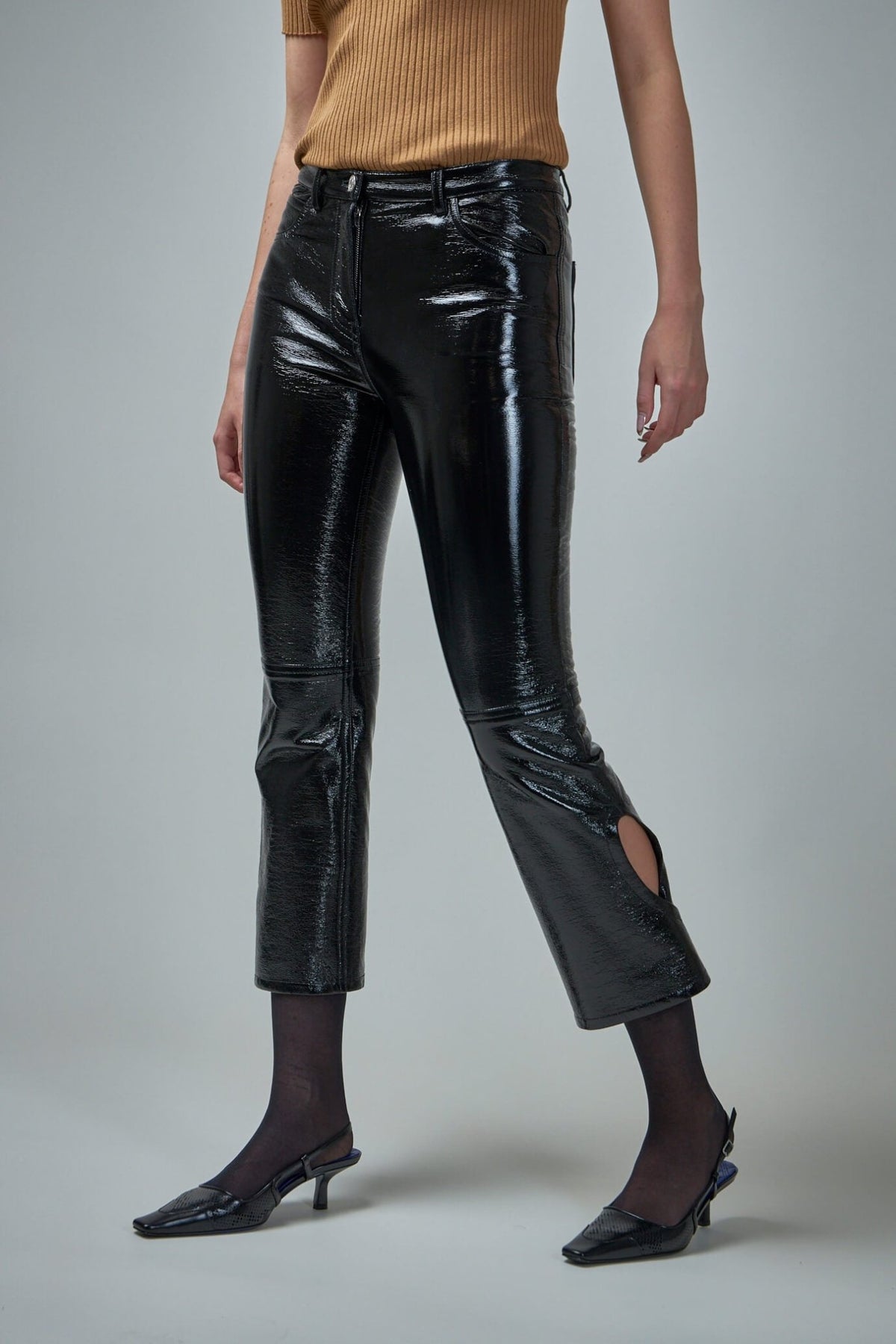 Full outfit styling of Courrèges vinyl pants with contemporary accessories