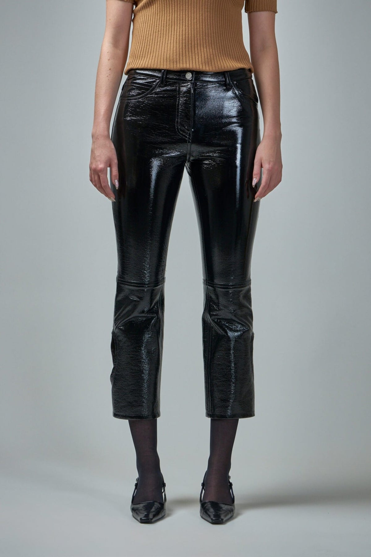 Courrèges Reversed Vinyl Pants in black with cropped silhouette and flex button details