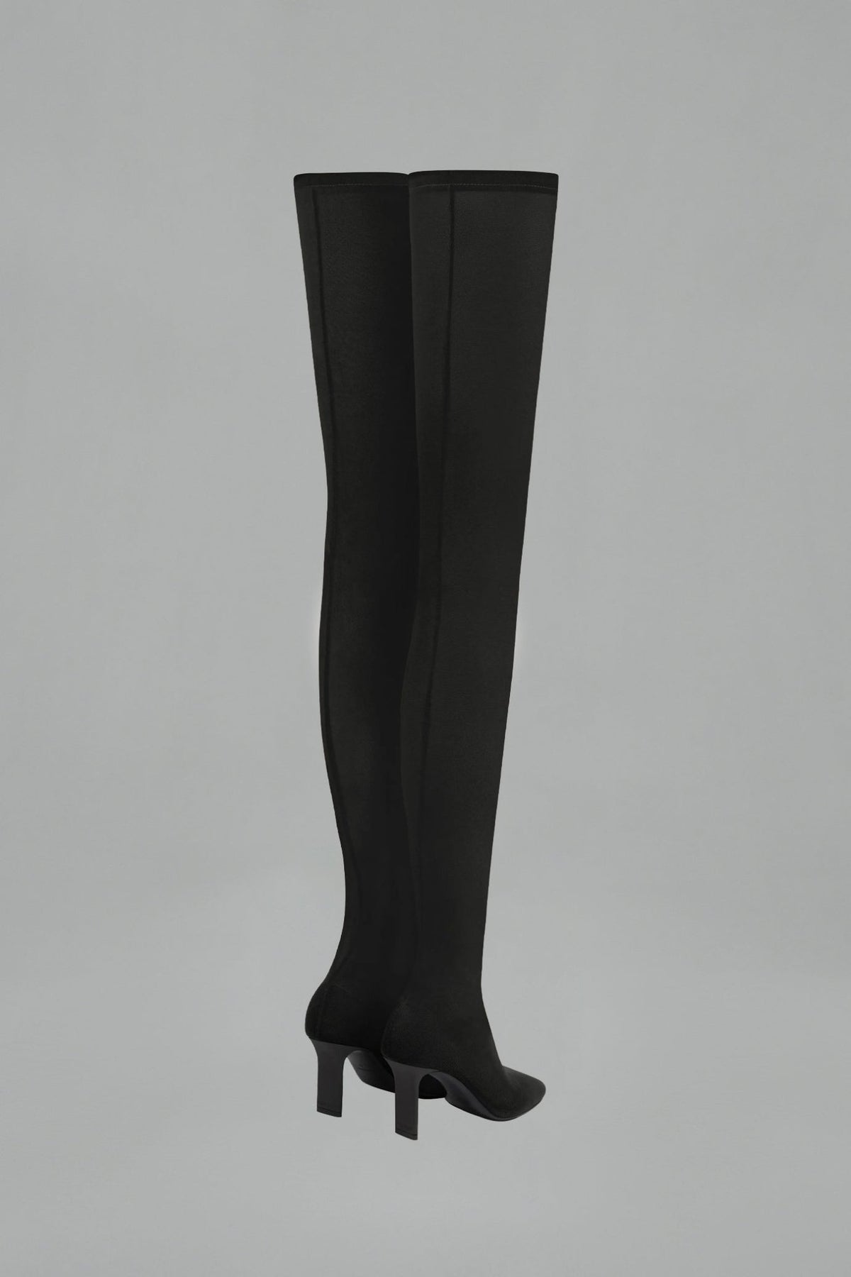 Side view of square toe mesh thigh boots showing sleek silhouette