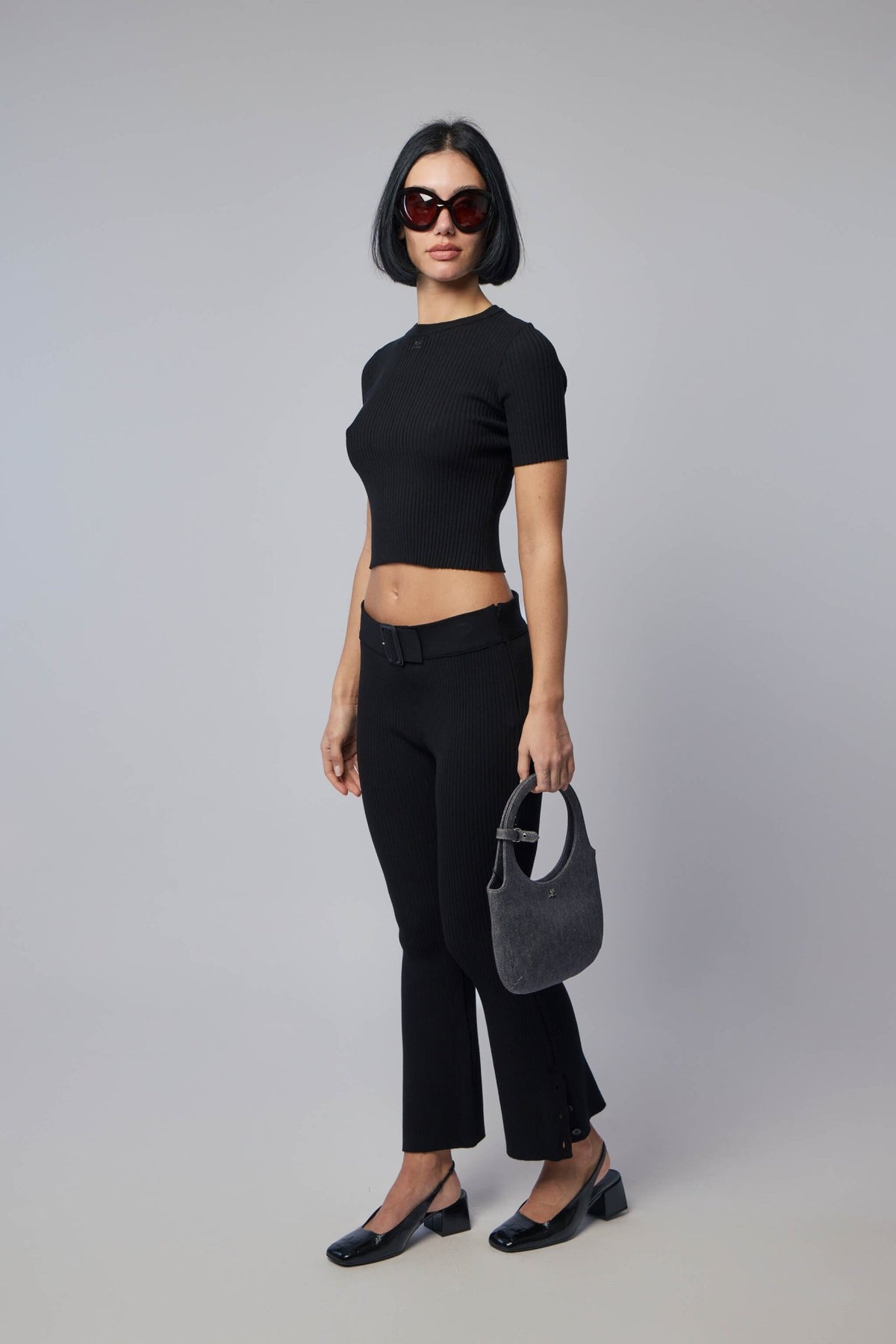 Full outfit featuring Courrèges ribbed knit blouse in modern setting