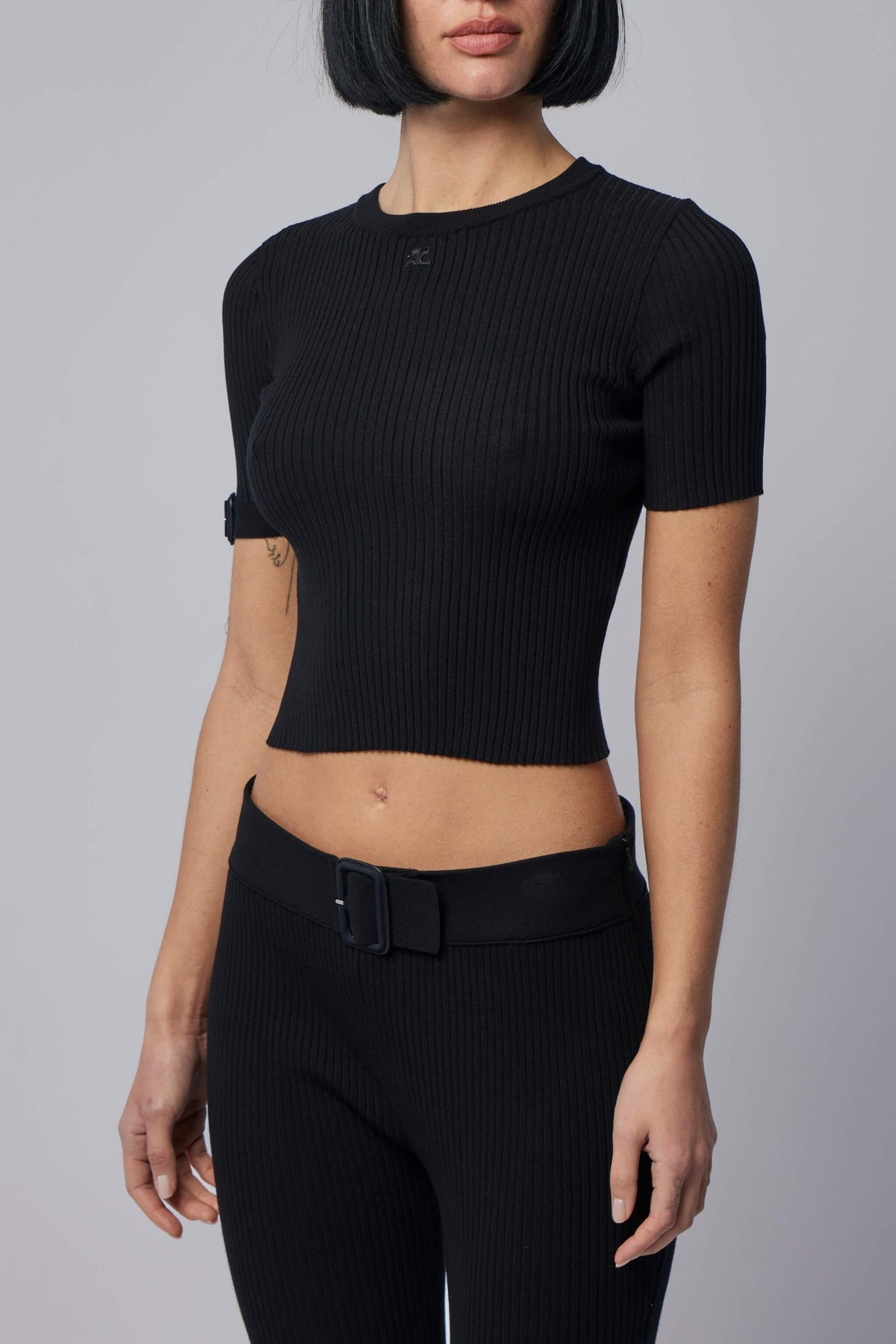 Model wearing Courrèges cropped ribbed top with round neckline