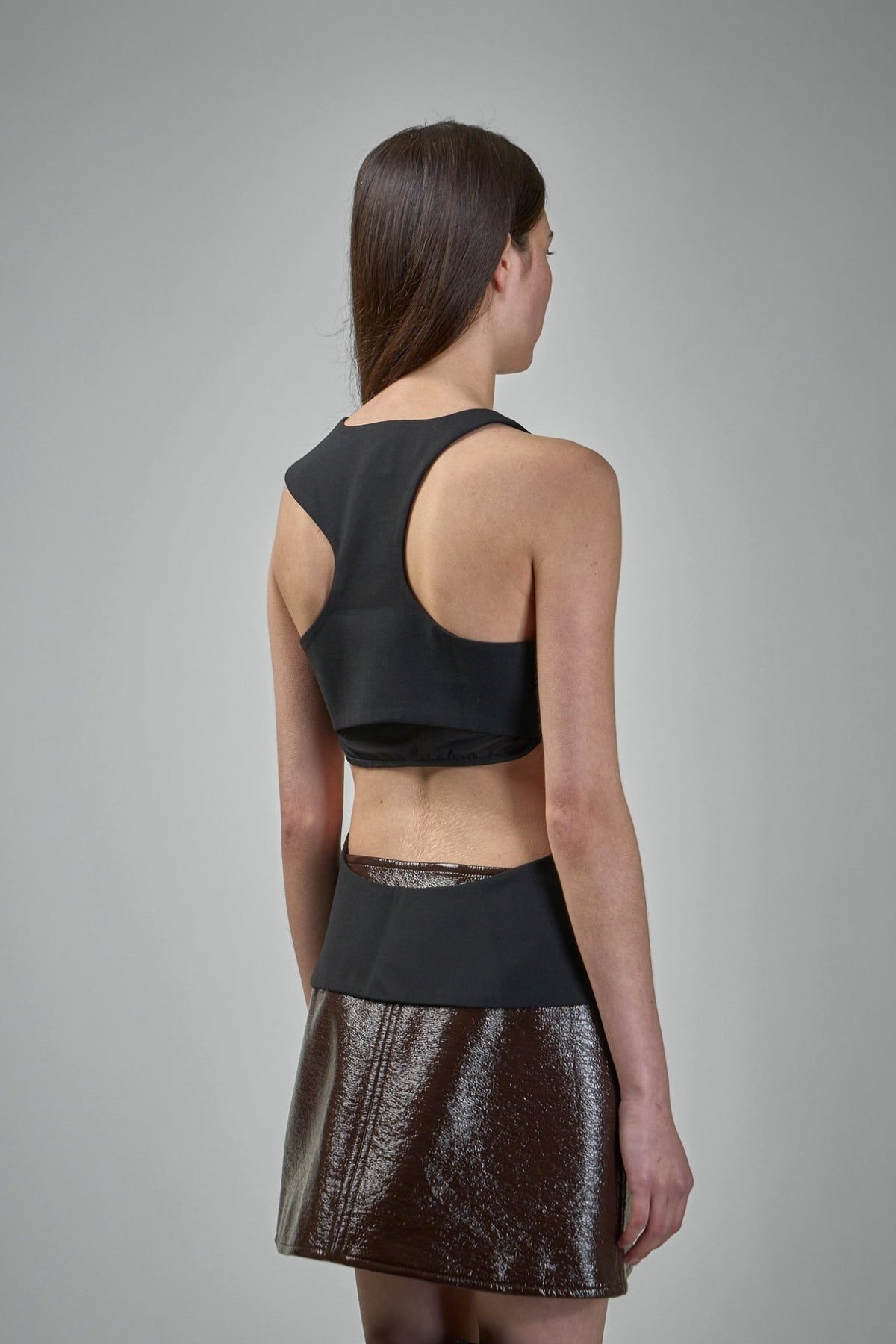 Model wearing Courrèges asymmetrical tank top, front view