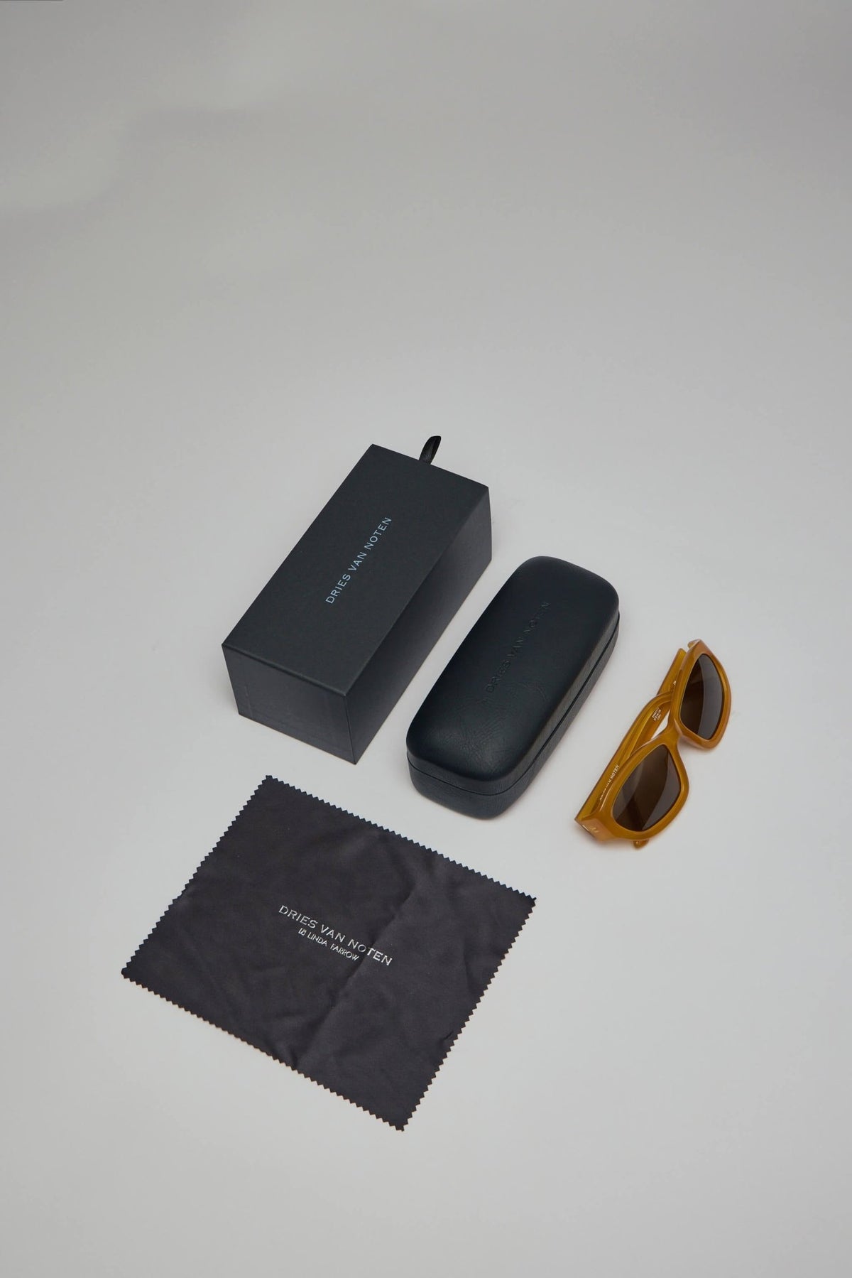 Lifestyle image of yellow designer sunglasses