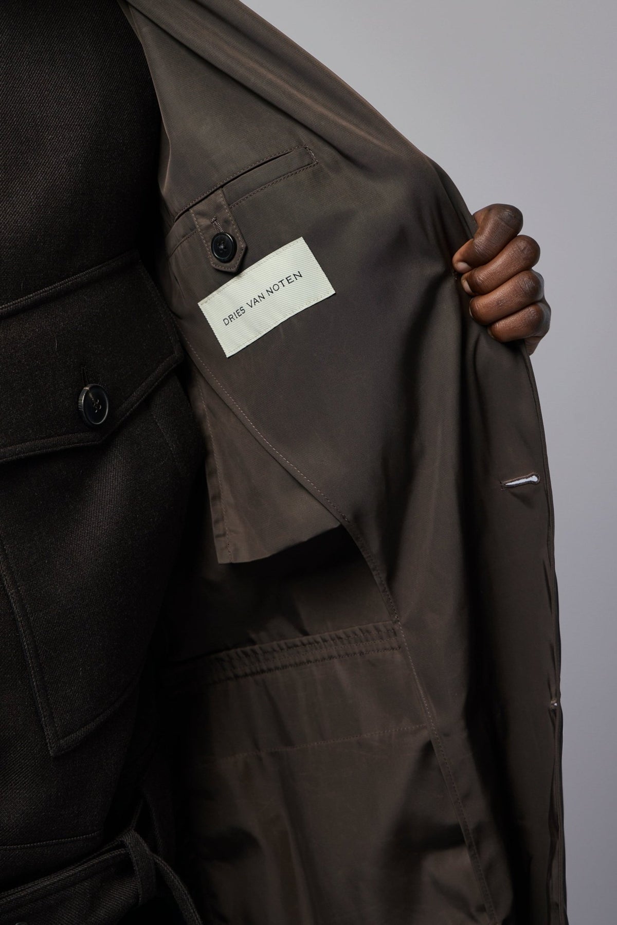 Full length view of model wearing Dries Van Noten brown wool coat