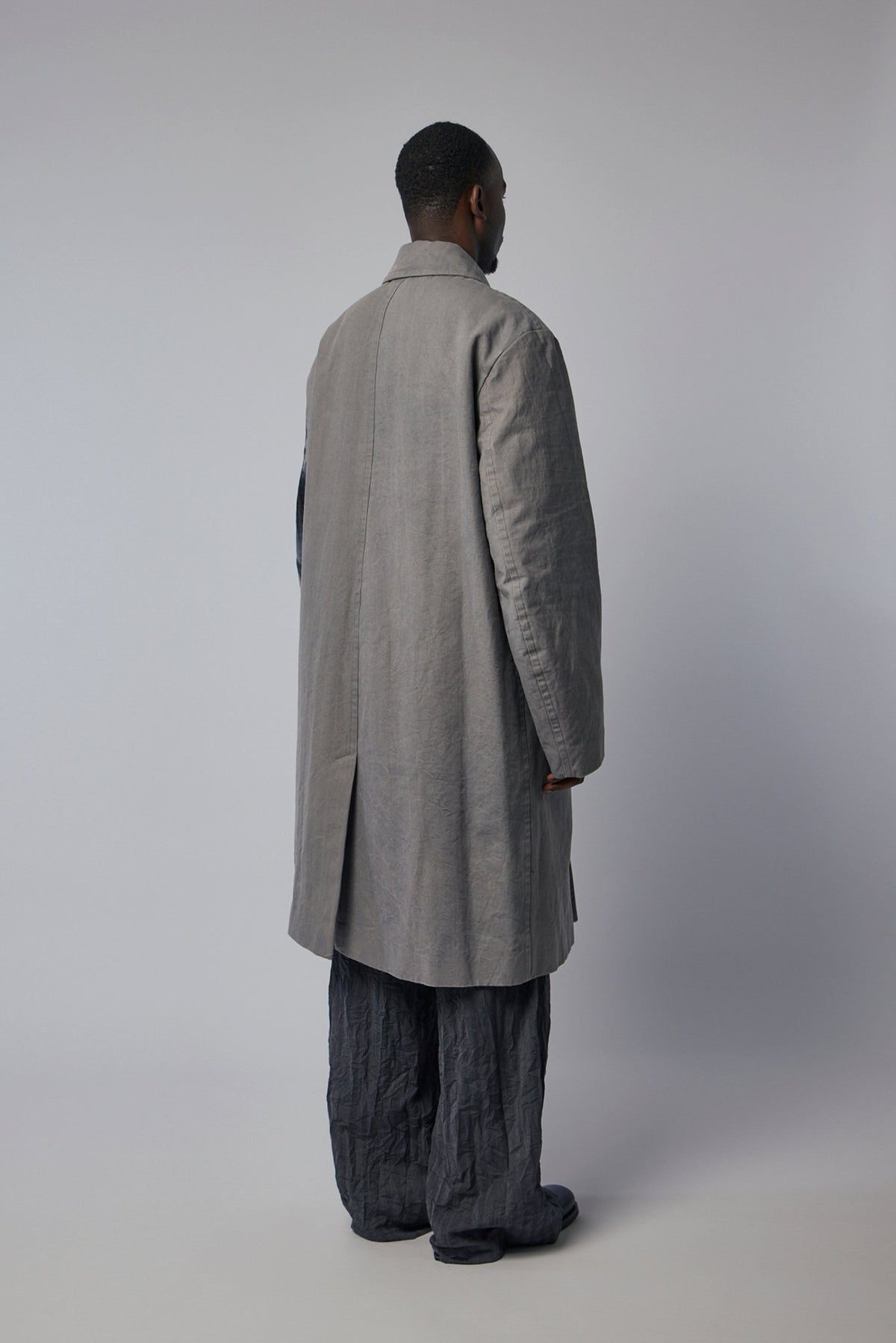 Model wearing Dries Van Noten M.W. Coat showing relaxed fit