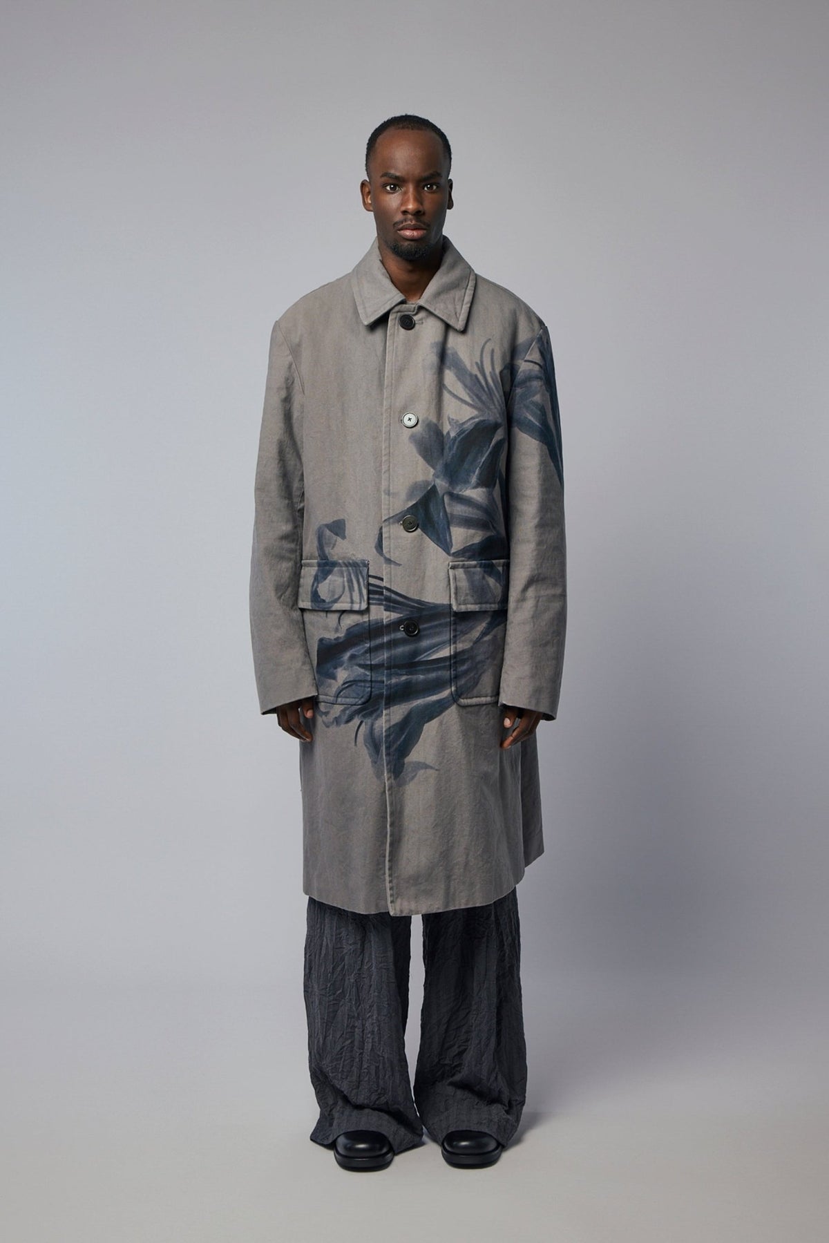 Close-up detail of floral pattern on Dries Van Noten cotton coat