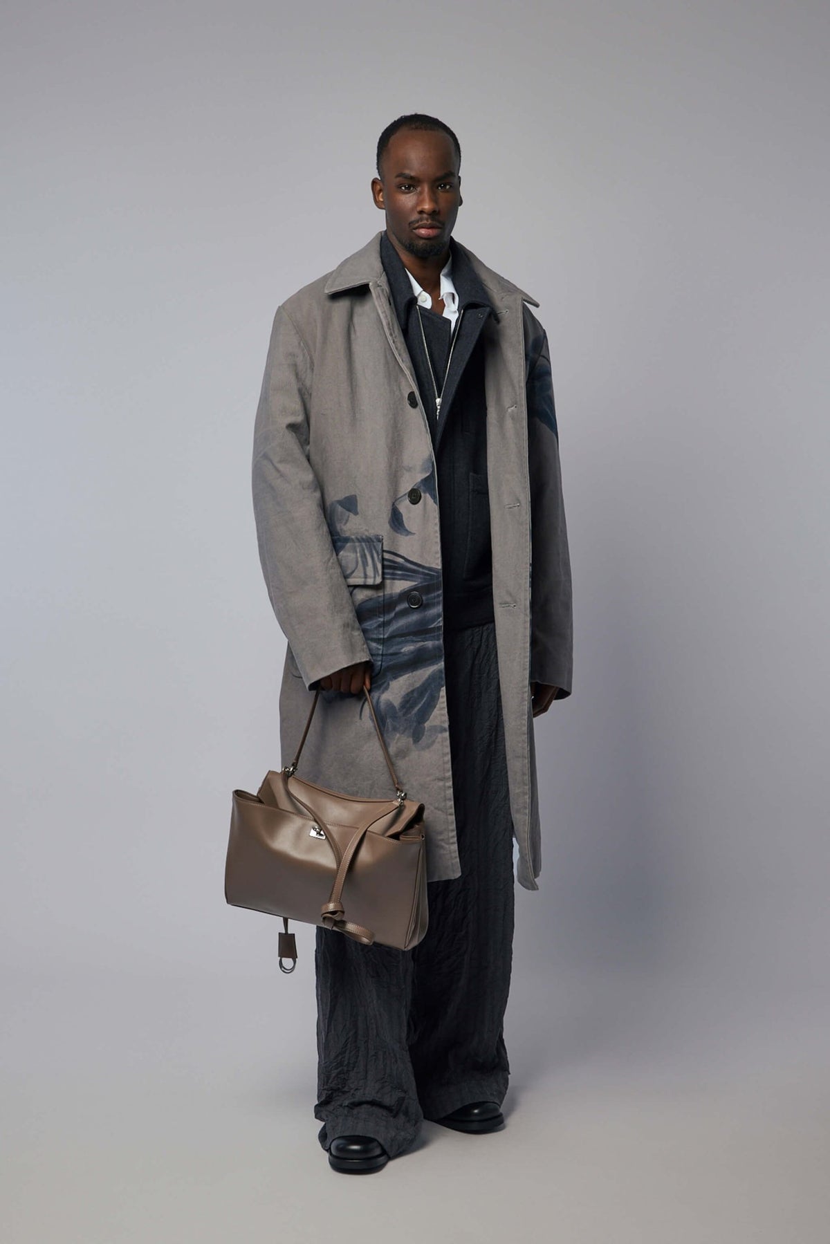 Full front view of artistic floral coat by Dries Van Noten