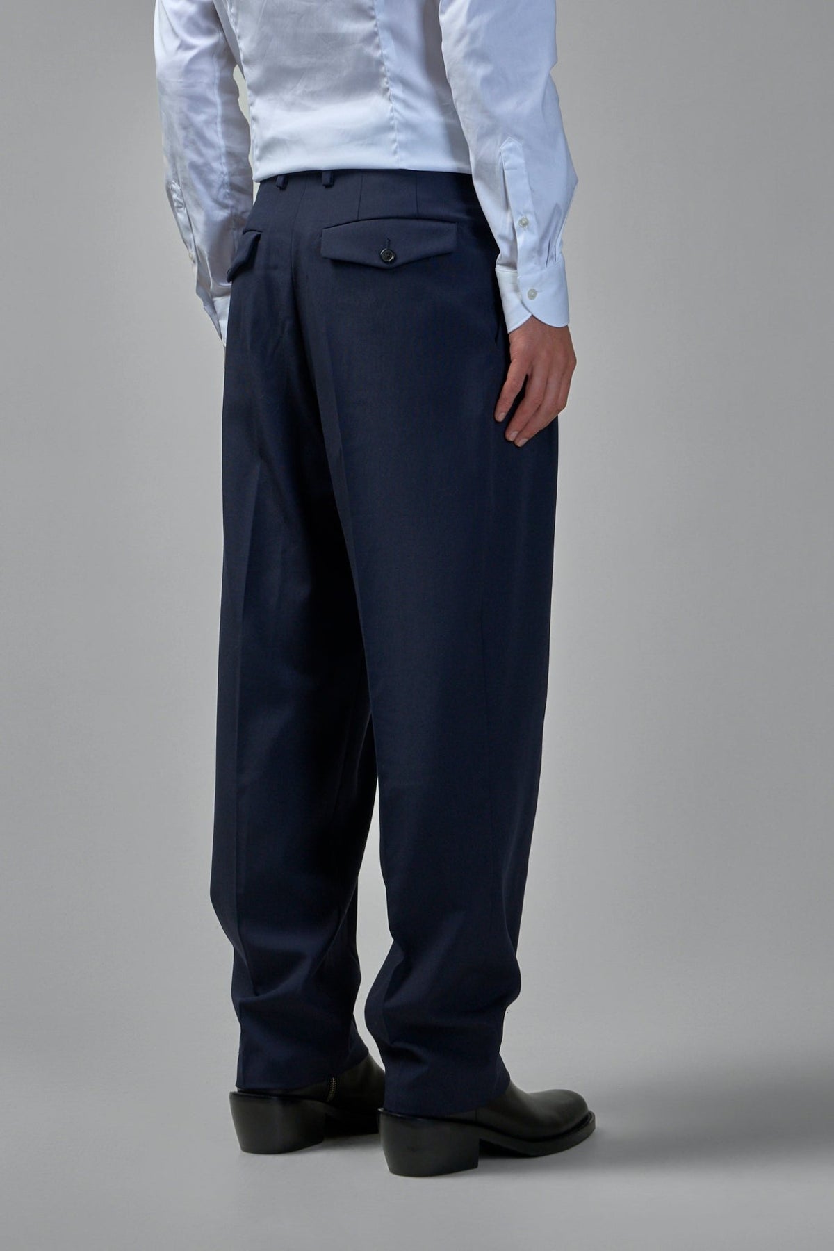 Side view showing relaxed fit silhouette and full-length wide leg cut