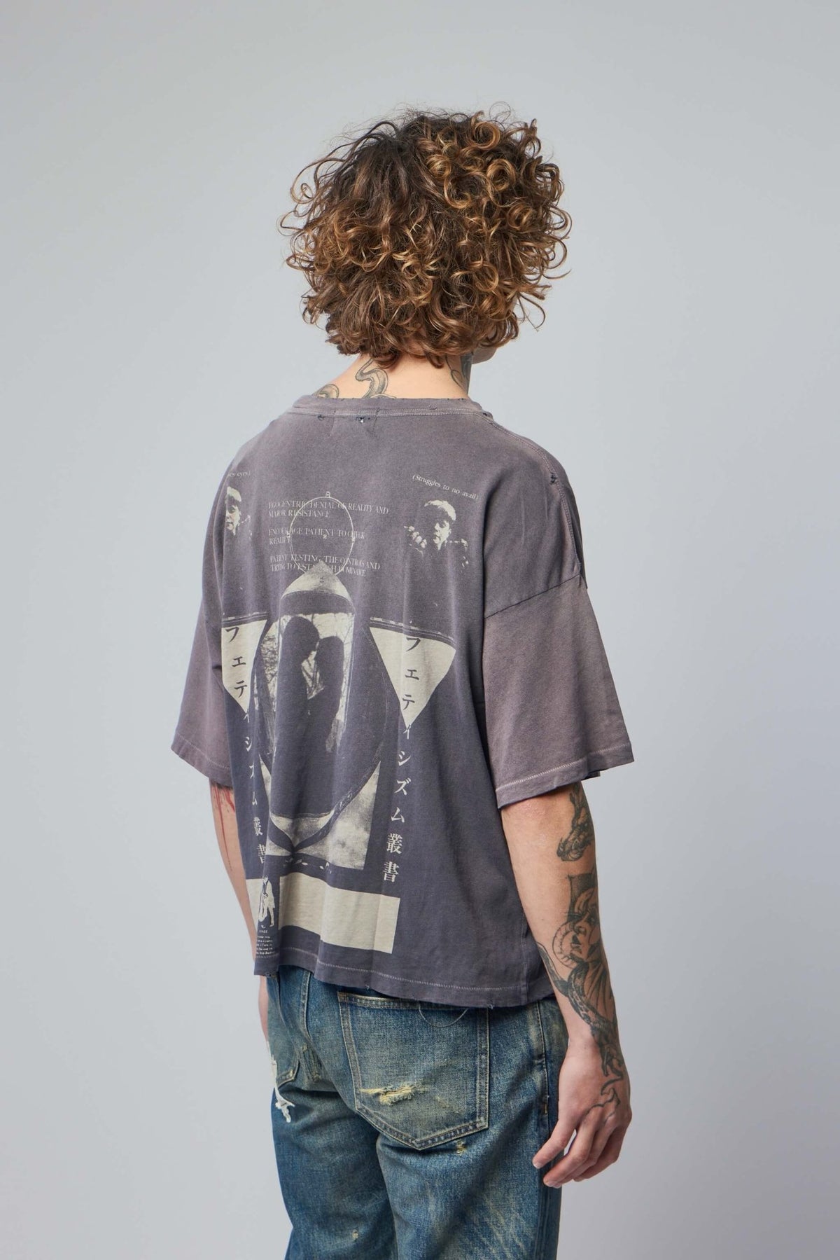 Flat lay styling of brown luxury t-shirt with accessories