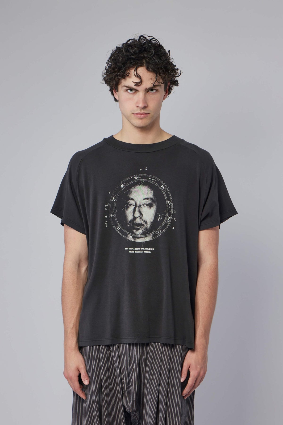 Close-up detail of raglan sleeve seaming on luxury streetwear t-shirt