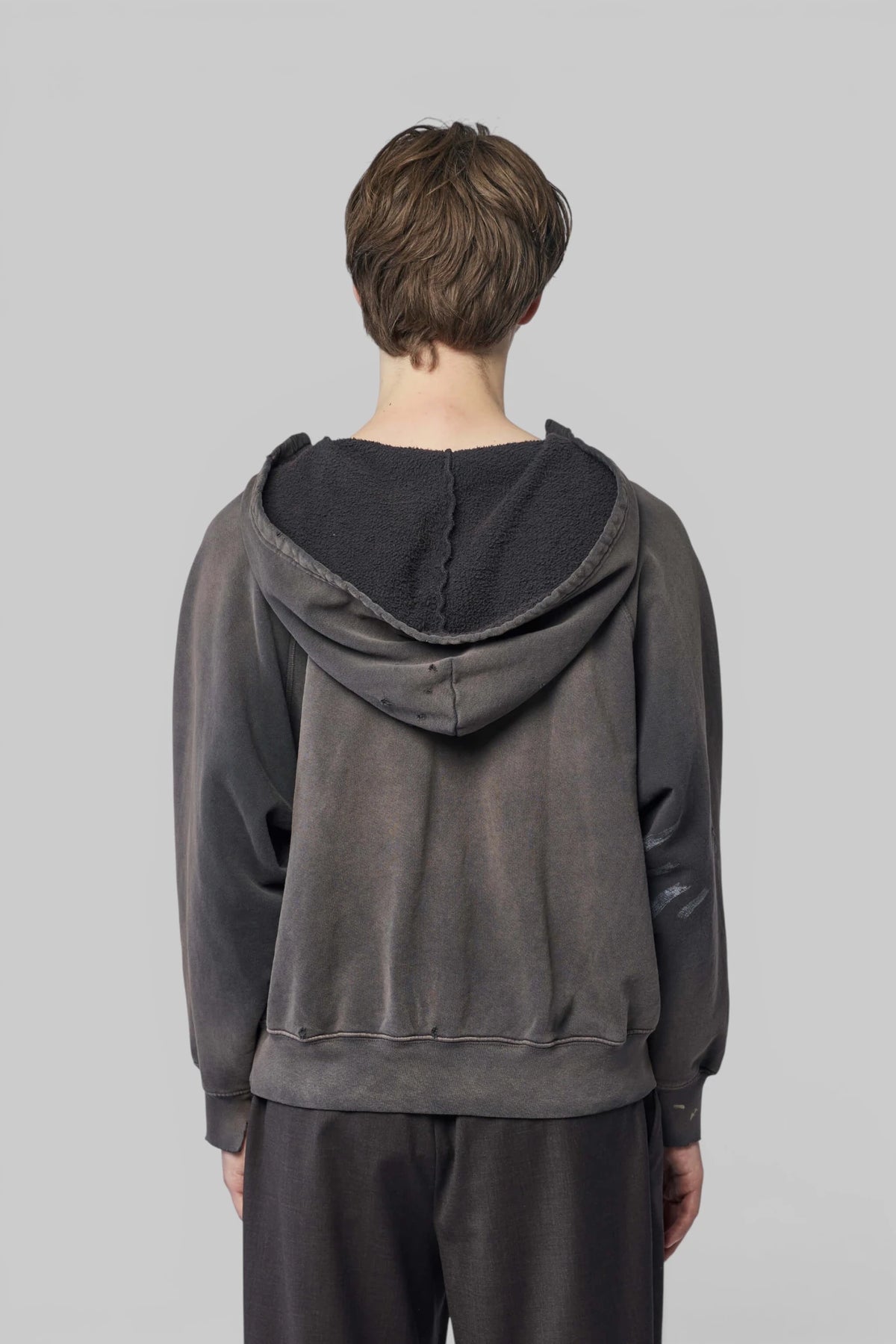 Model wearing Enfants Riches Déprimés hoodie with denim