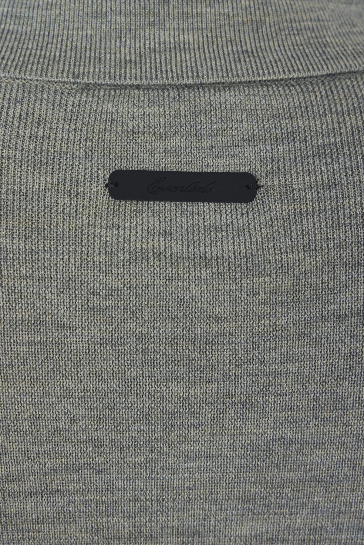 Detail shot of wool texture and stitching on the Signature 90's Knit Polo