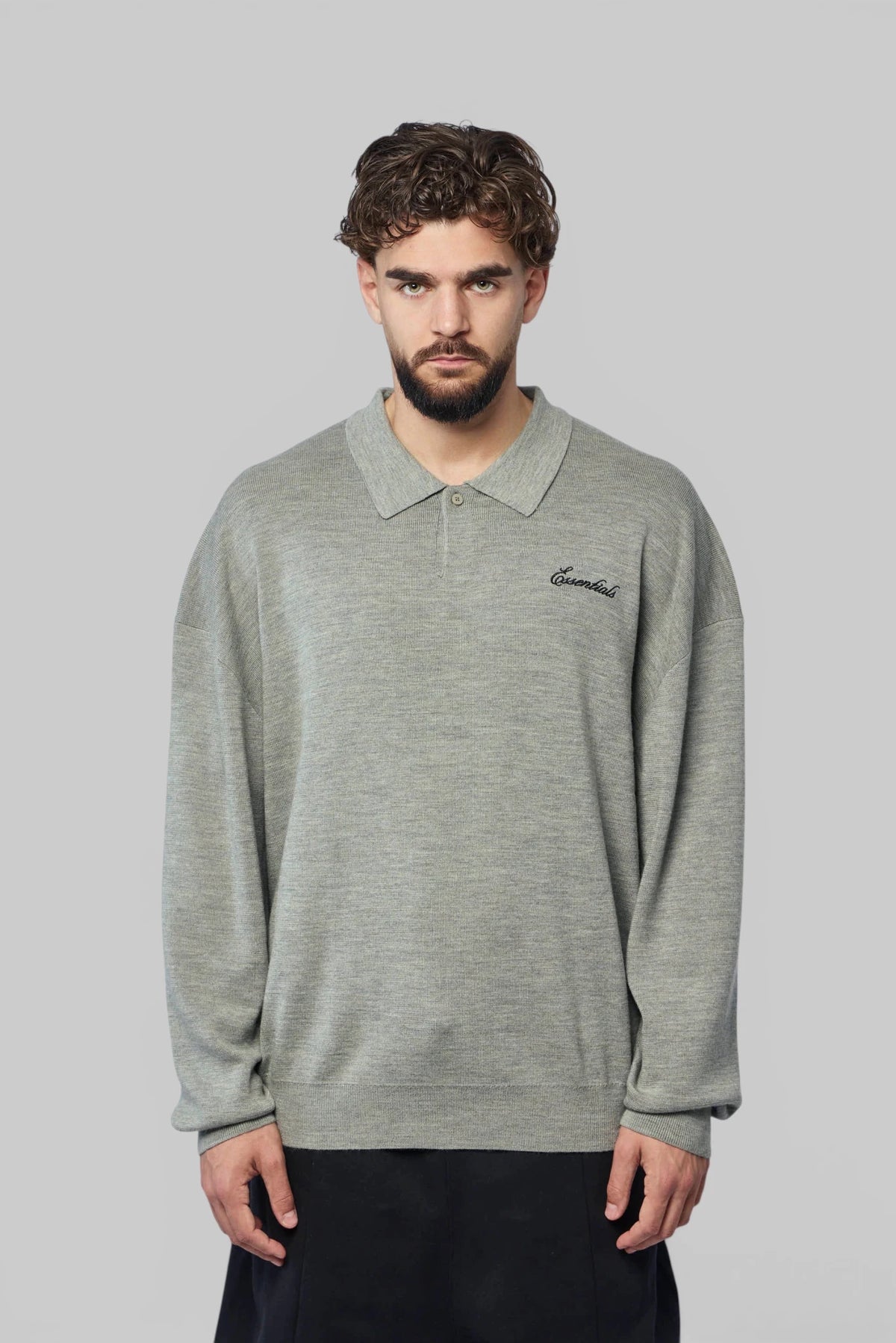 Fear Of God Essentials Knit Polo styled with ribbed cuffs, close-up