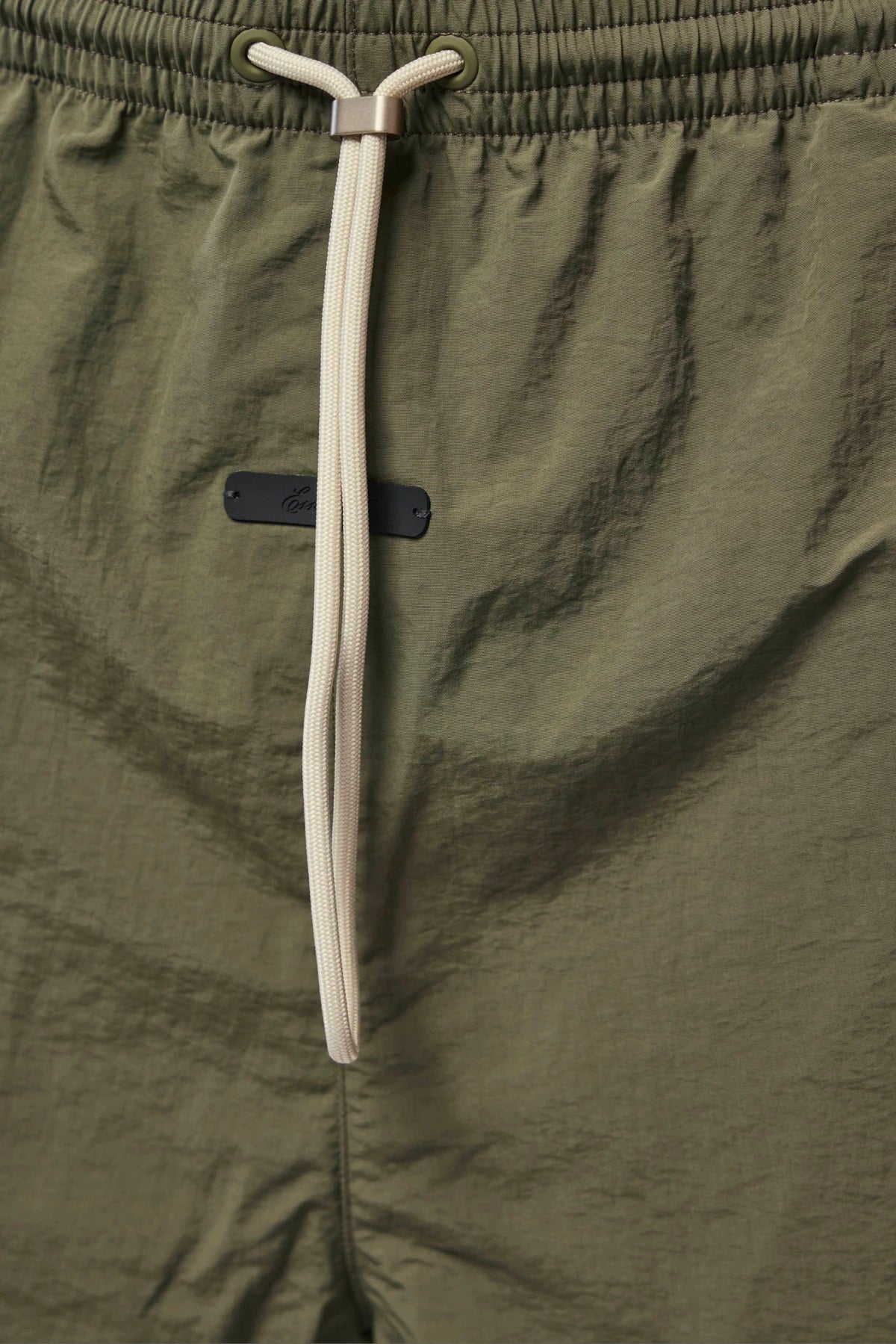 Fabric texture close-up of Fear Of God Essentials Cargo Pants