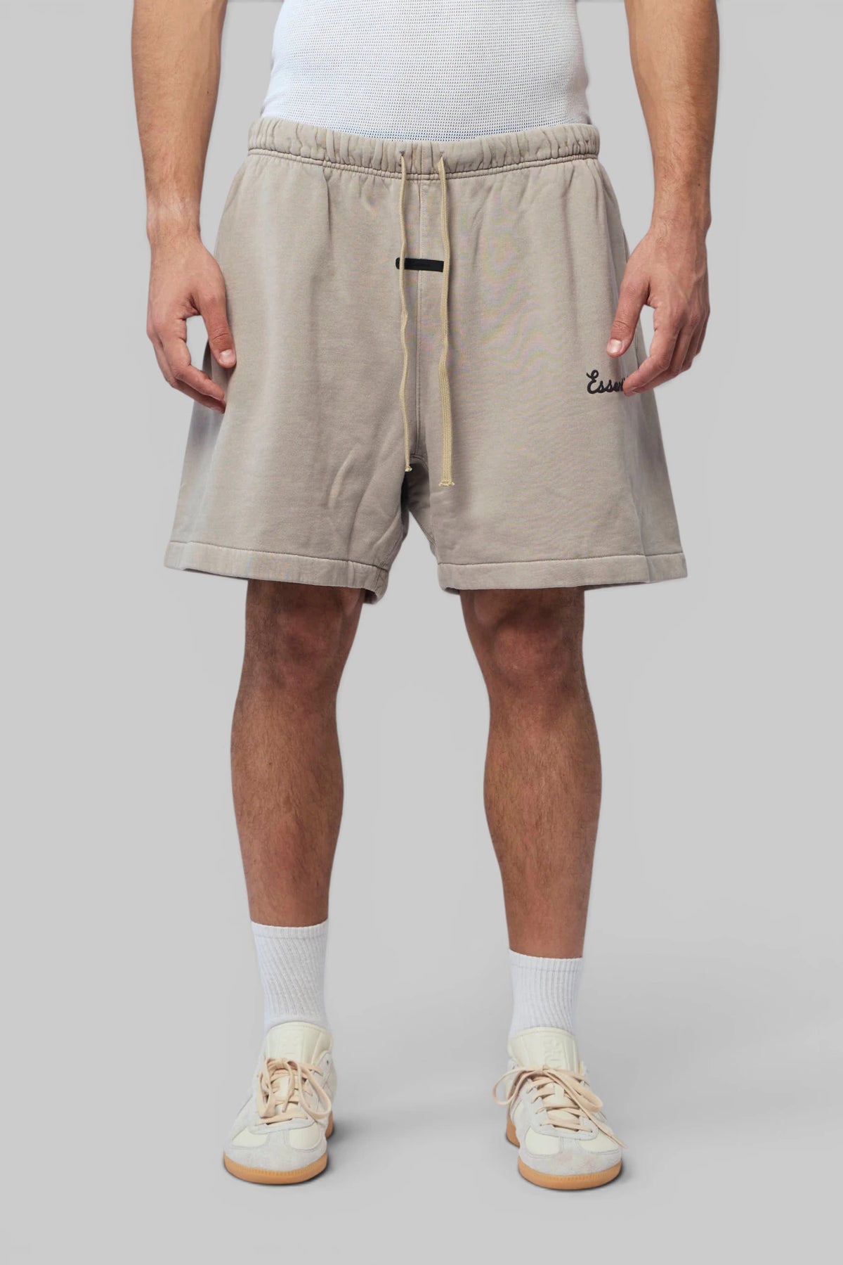 Fear Of God Essentials Shorts side profile with logo on left leg