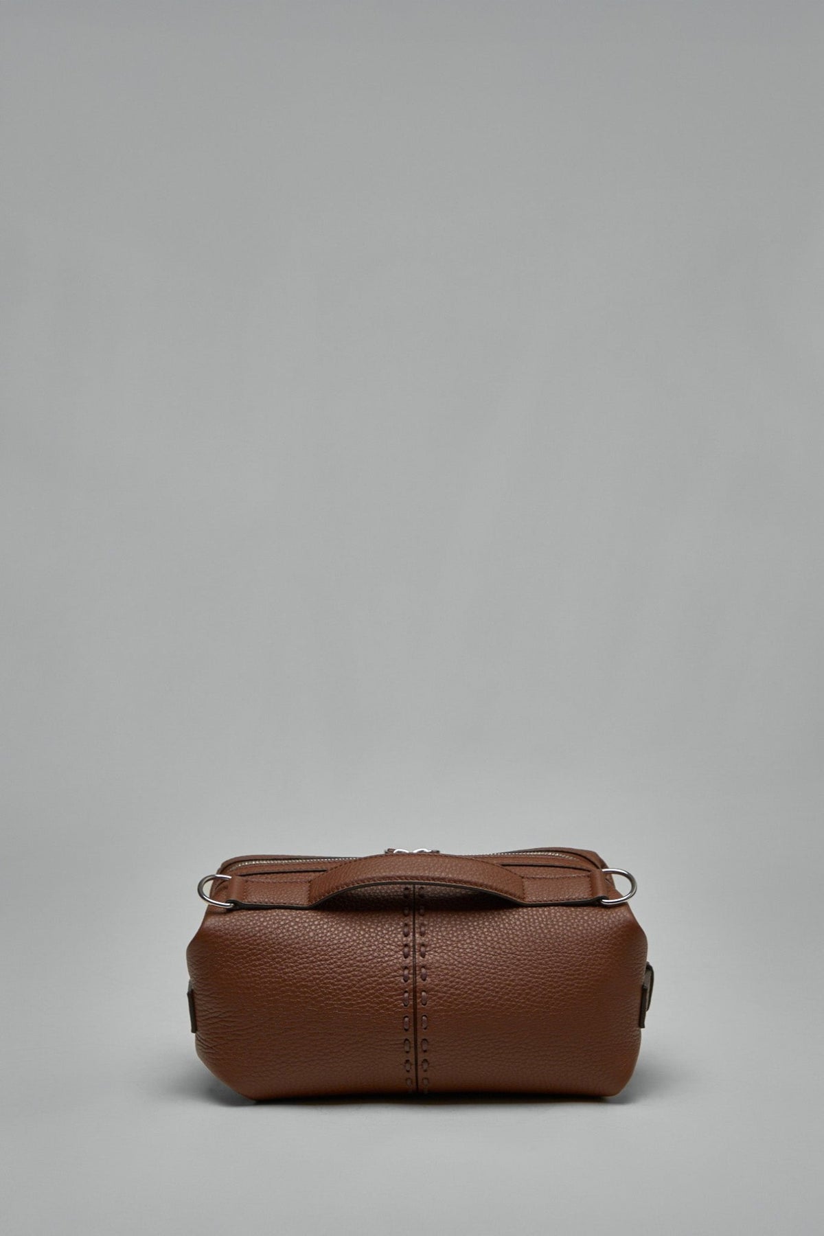 Close-up view of Fendi Siesta bag showing silver-tone hardware and zip closure
