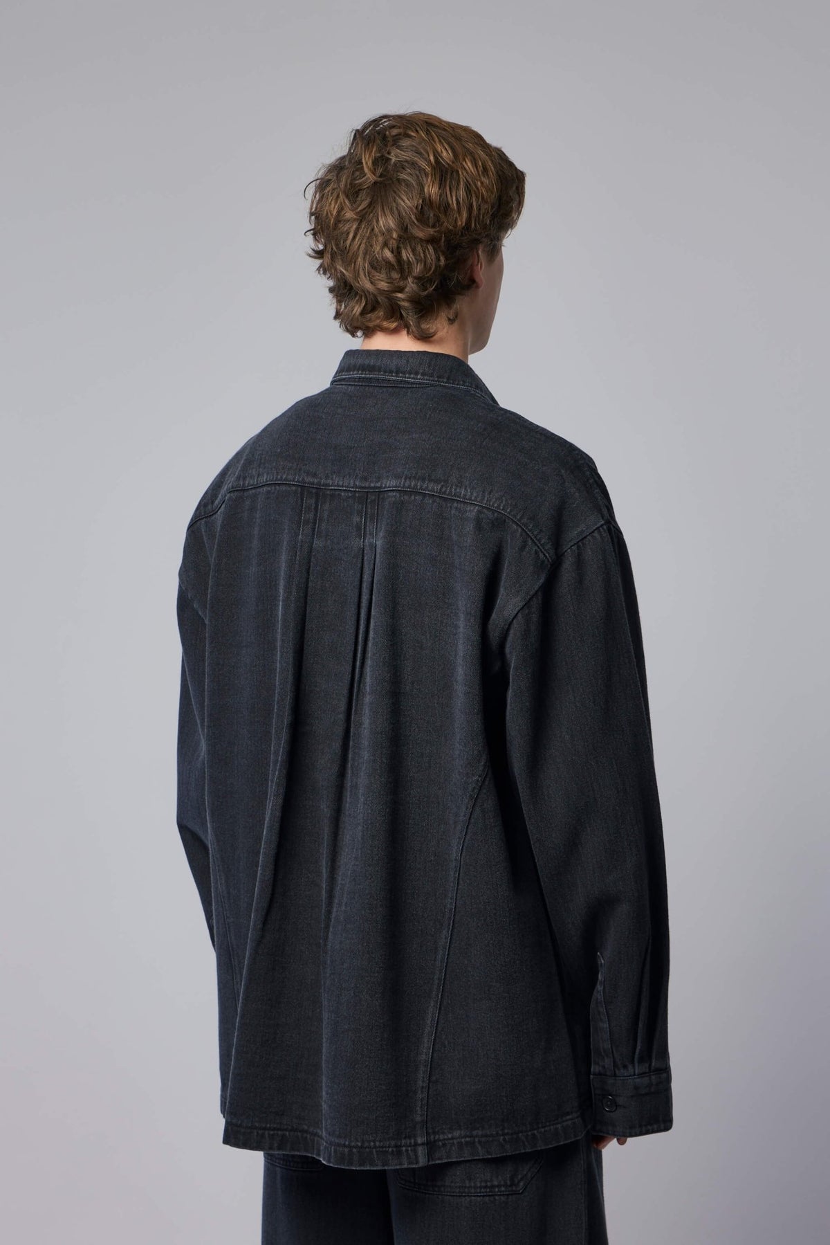 Detail shot of chest pocket and collar on FREI-MUT denim jacket