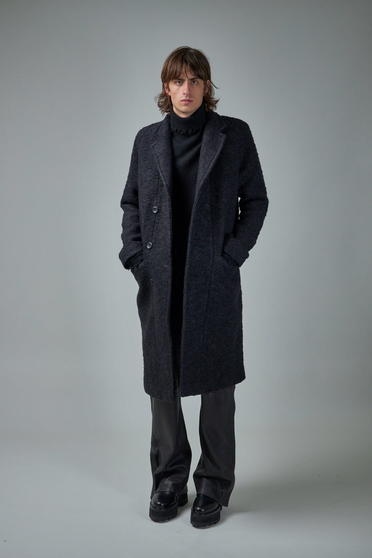 Model wearing FREI-MUT Murdock Coat demonstrating classic fit and styling