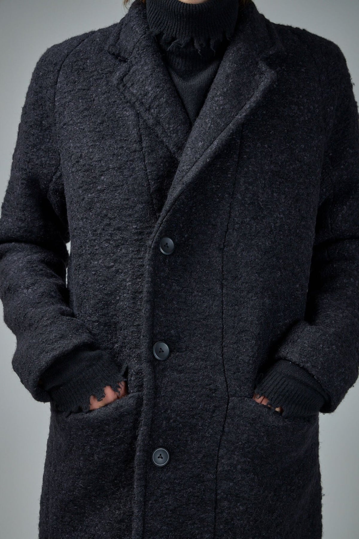 Full-length view of FREI-MUT Murdock Coat showcasing sophisticated silhouette