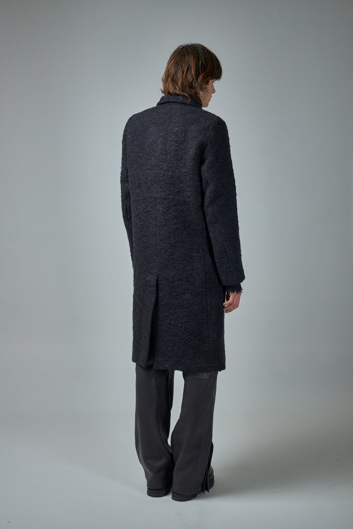 Close-up detail of Murdock Coat button closure and refined tailoring