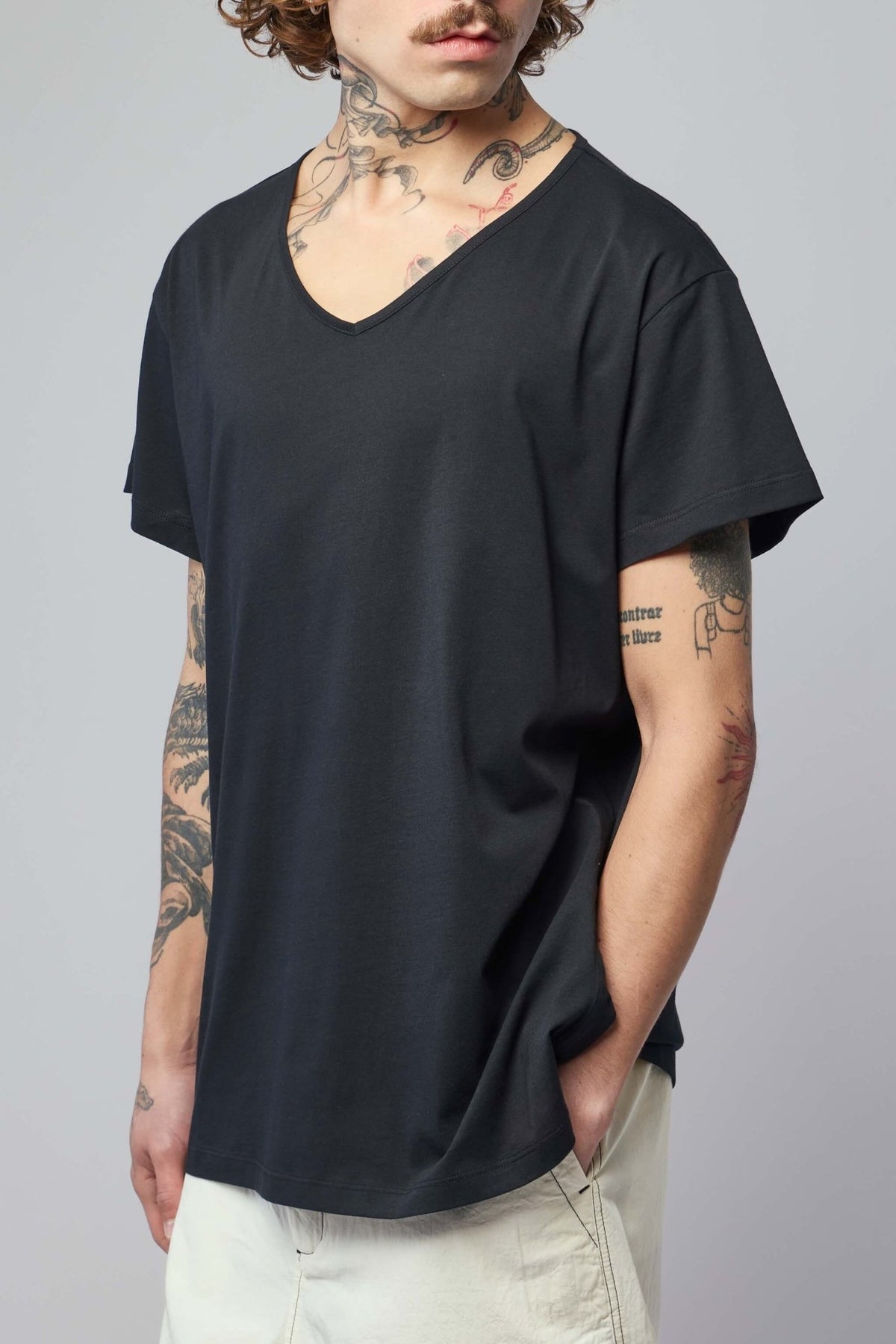 Model wearing FREI-MUT Tara t-shirt showcasing true-to-size fit