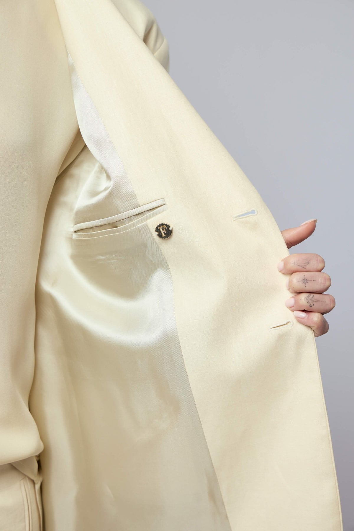 Back view of Frenken Crush Linen Wrap Blazer showcasing the elegant draping and tailoring details, view 7