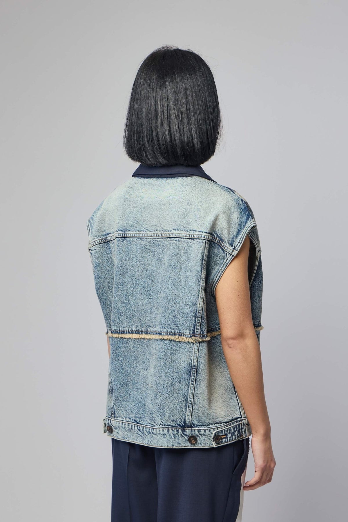 Back view of navy blazer showing tailored silhouette