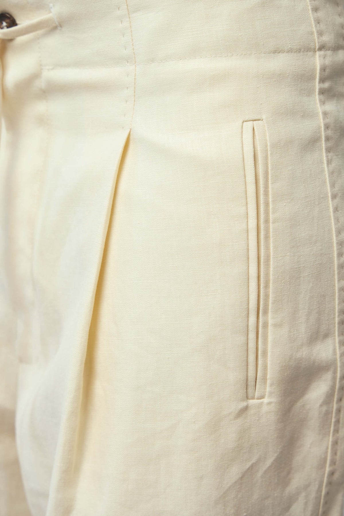 Side view of Frenken wide-leg trousers demonstrating elegant drape
