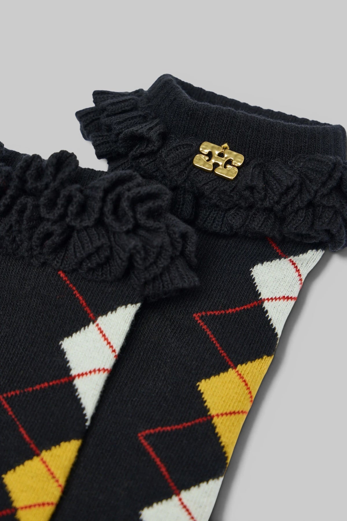 Ganni argyle socks styled with contemporary fashion pieces