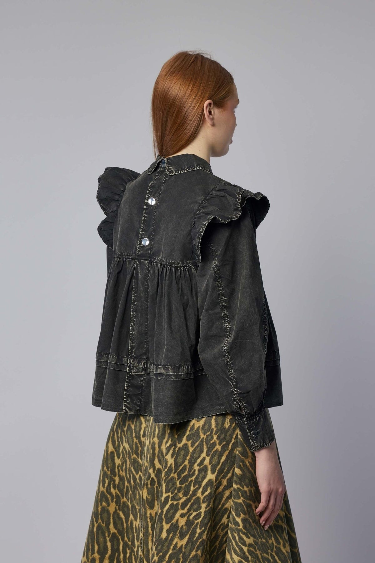 Detail shot of collared neckline and vintage-inspired construction on Ganni blouse