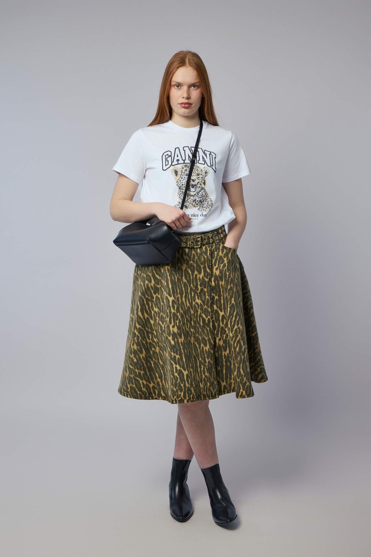 Back view of Ganni print denim midi skirt showing A-line shape and fit