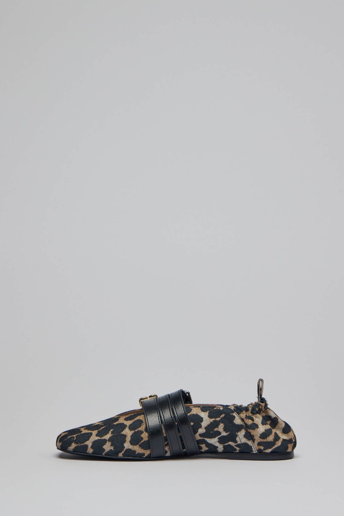 Side profile of Ganni leopard print flats with elasticated back strap