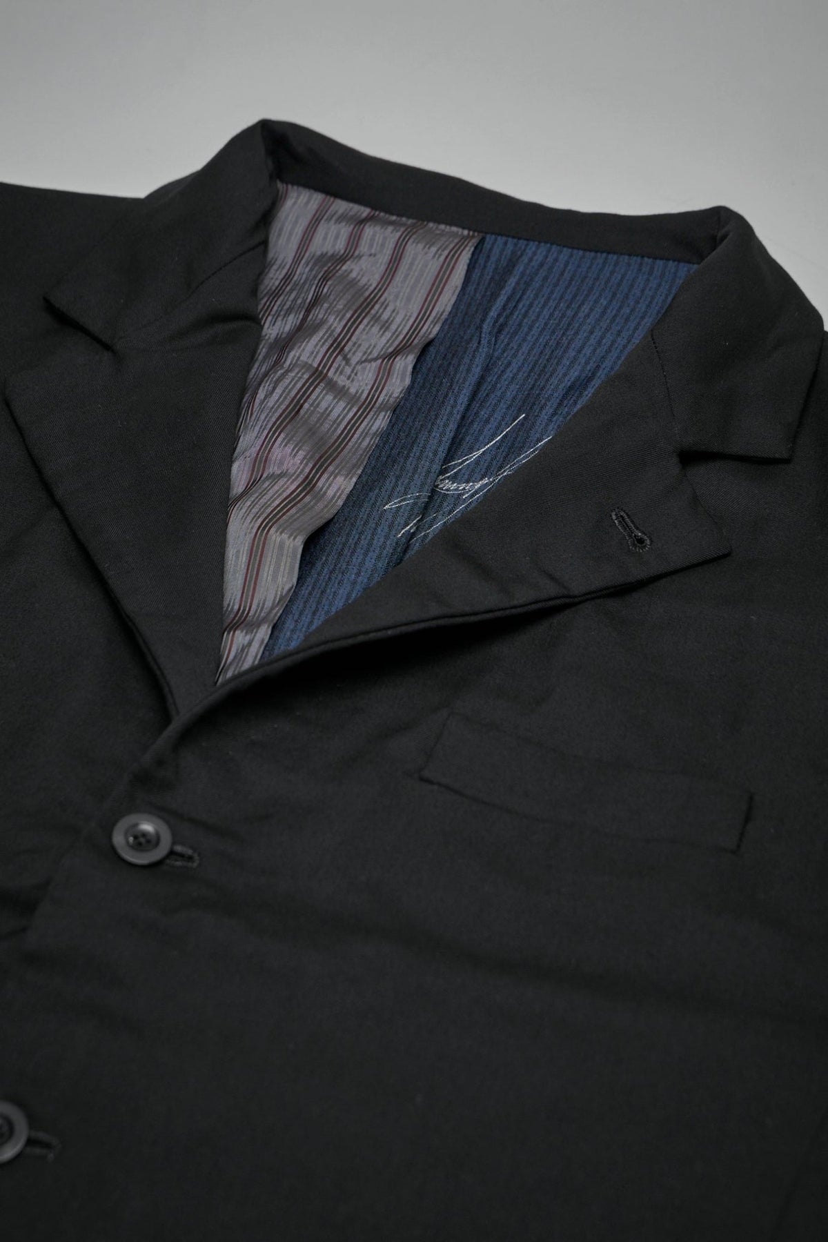 Back view showing traditional tailoring and single vent construction