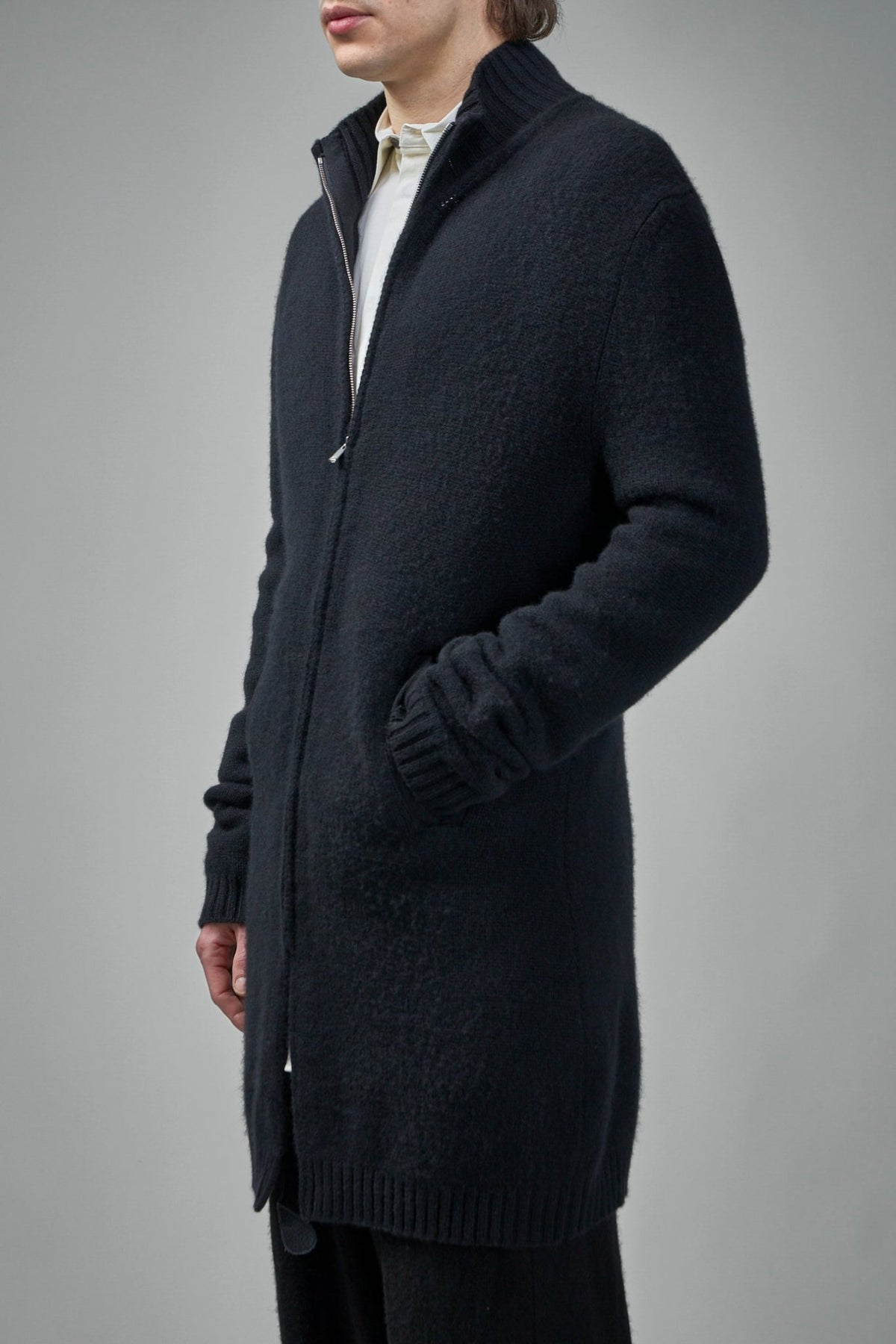 Close-up of Excella zipper and pure silk label on cashmere cardigan
