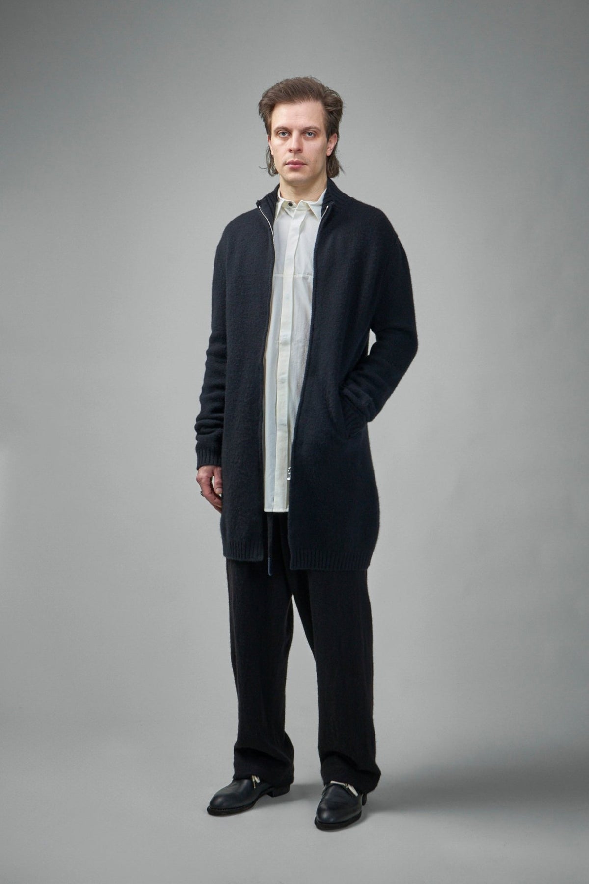 Luxury cashmere cardigan showing handmade construction details and premium materials