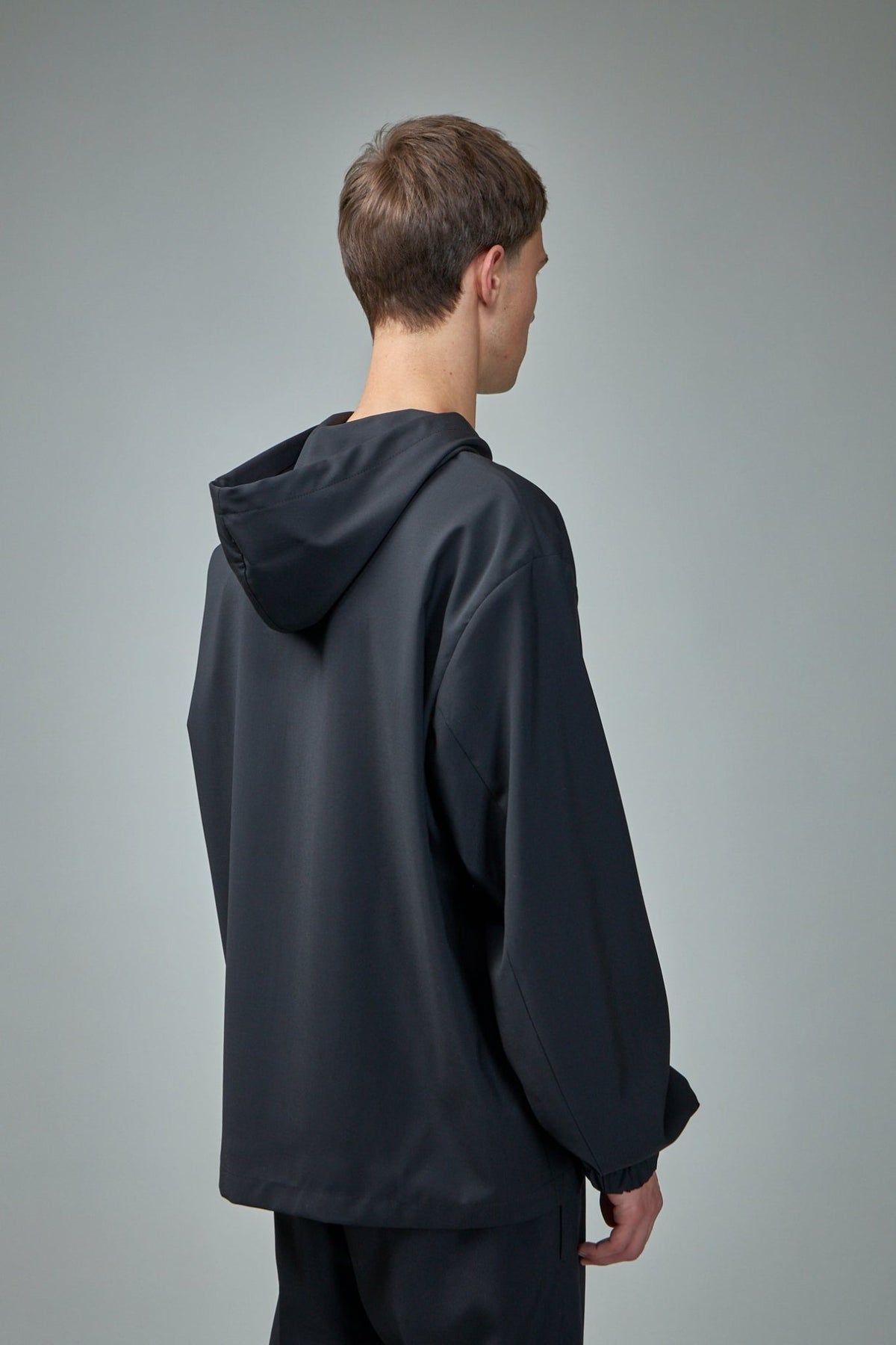 Model wearing Givenchy hooded blouson showcasing contemporary streetwear styling