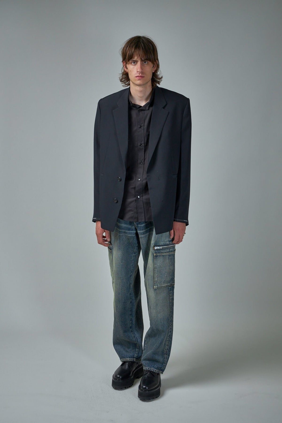 Close-up view of Givenchy wool blazer showing button closure and lapel details