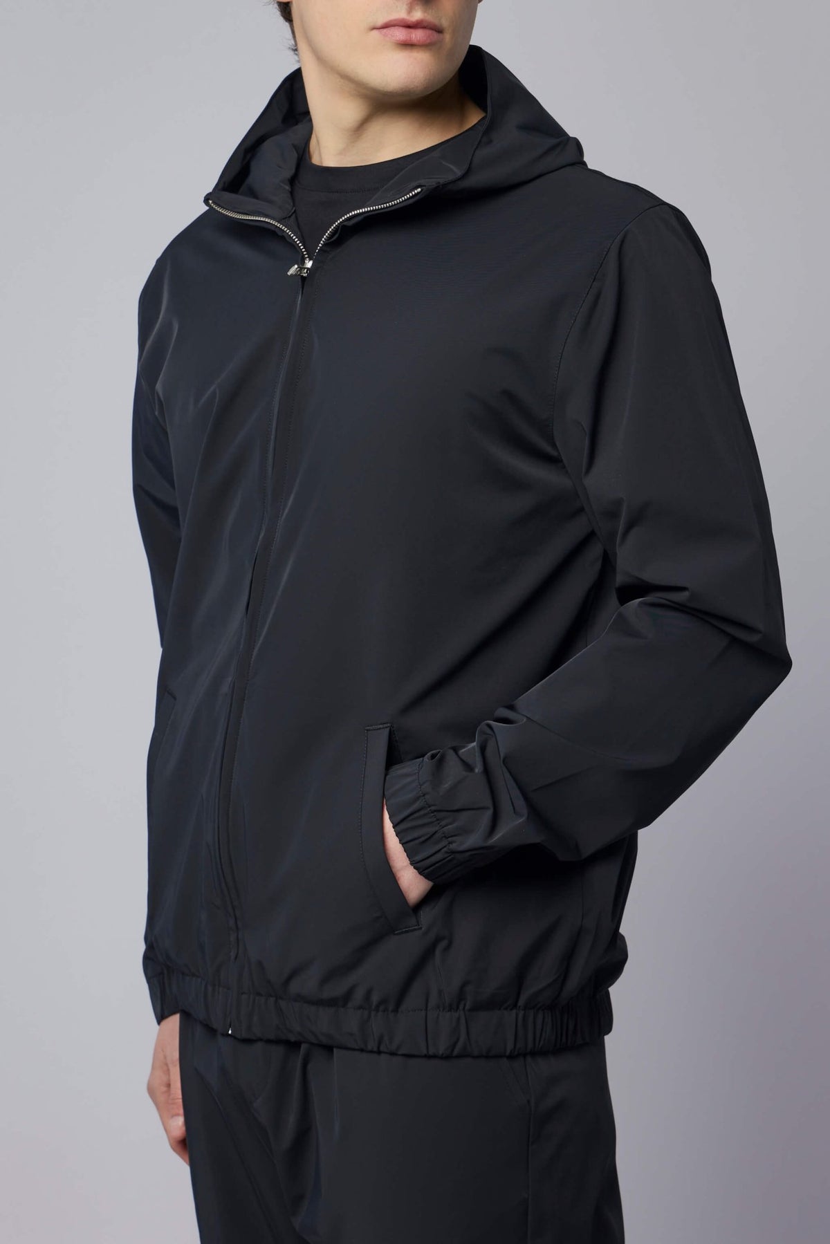 Side view showing relaxed fit and elasticated cuffs of Helix jacket