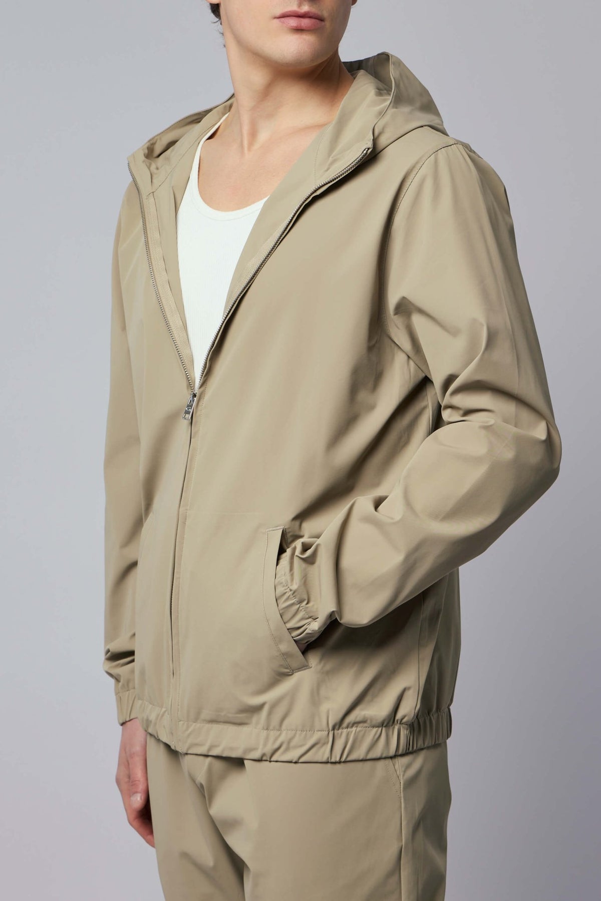 Model wearing Gogetti Helix jacket showing tapered fit