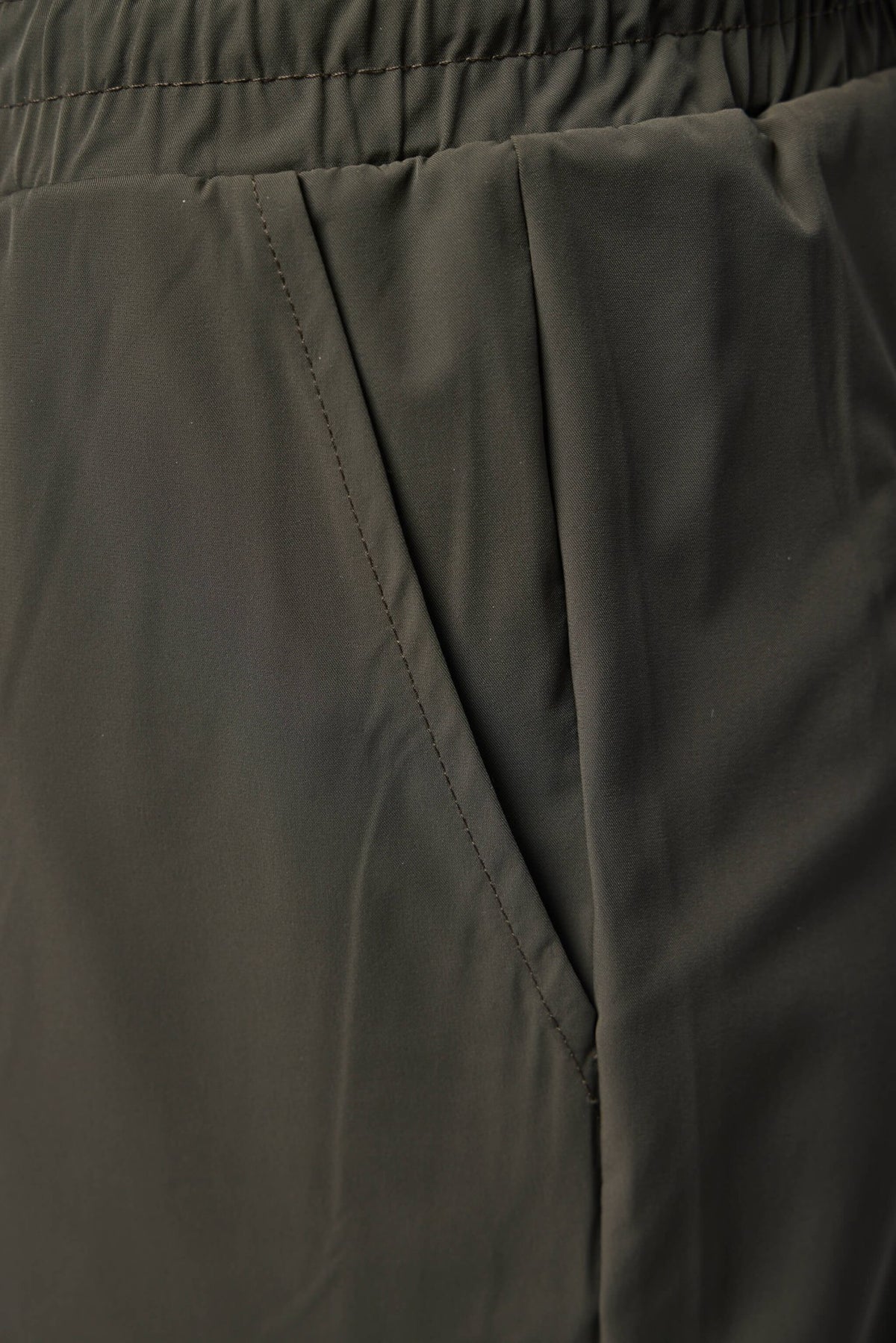 Model wearing Gogetti Helix cargo trousers in casual styling