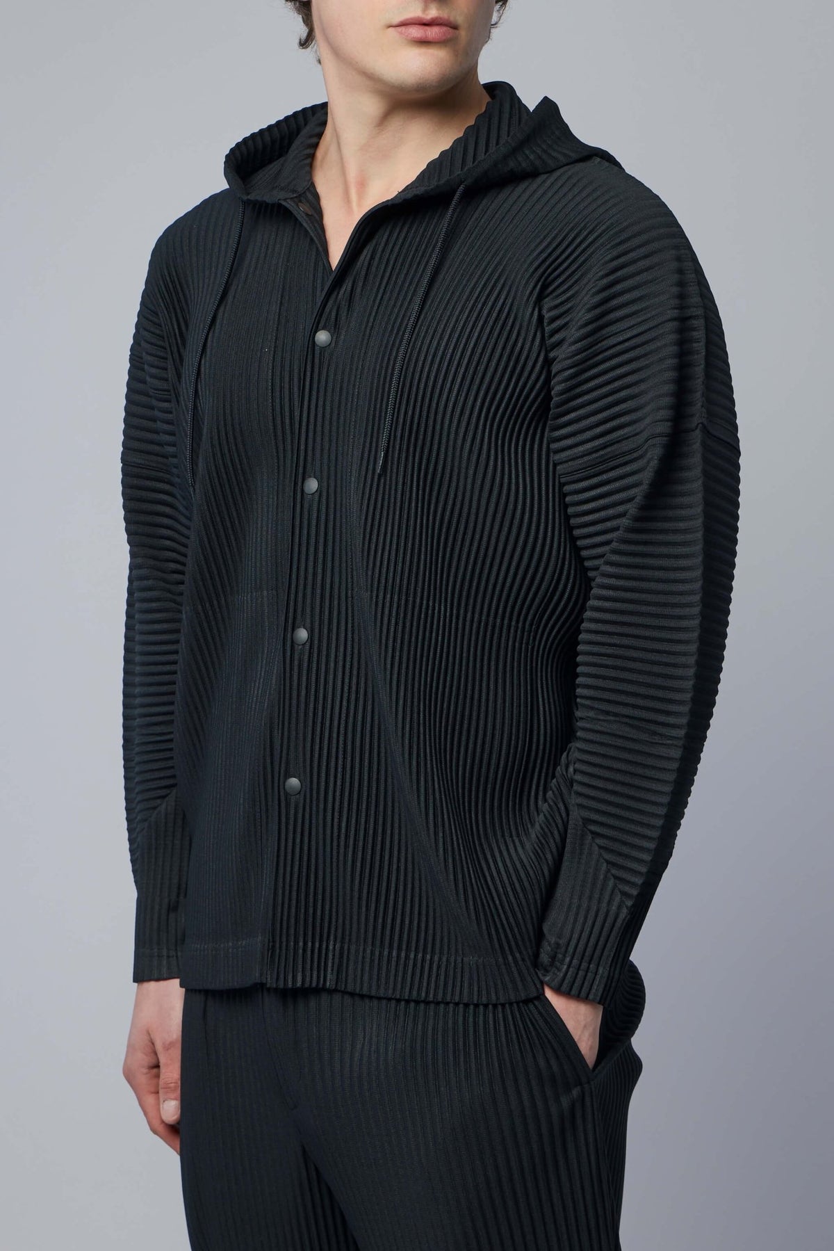 Model wearing relaxed fit blouson showing architectural silhouette