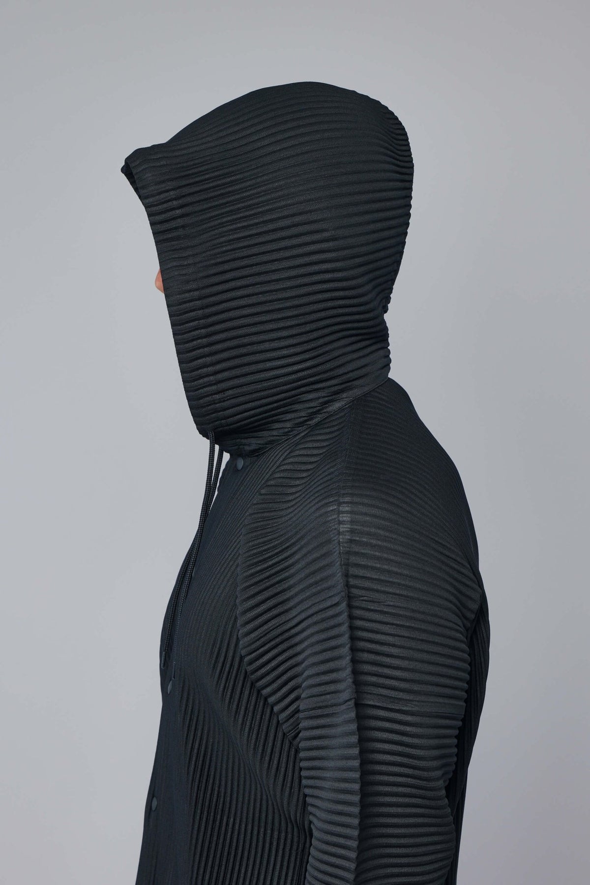 Styling shot showing hoodie worn casually with minimal accessories