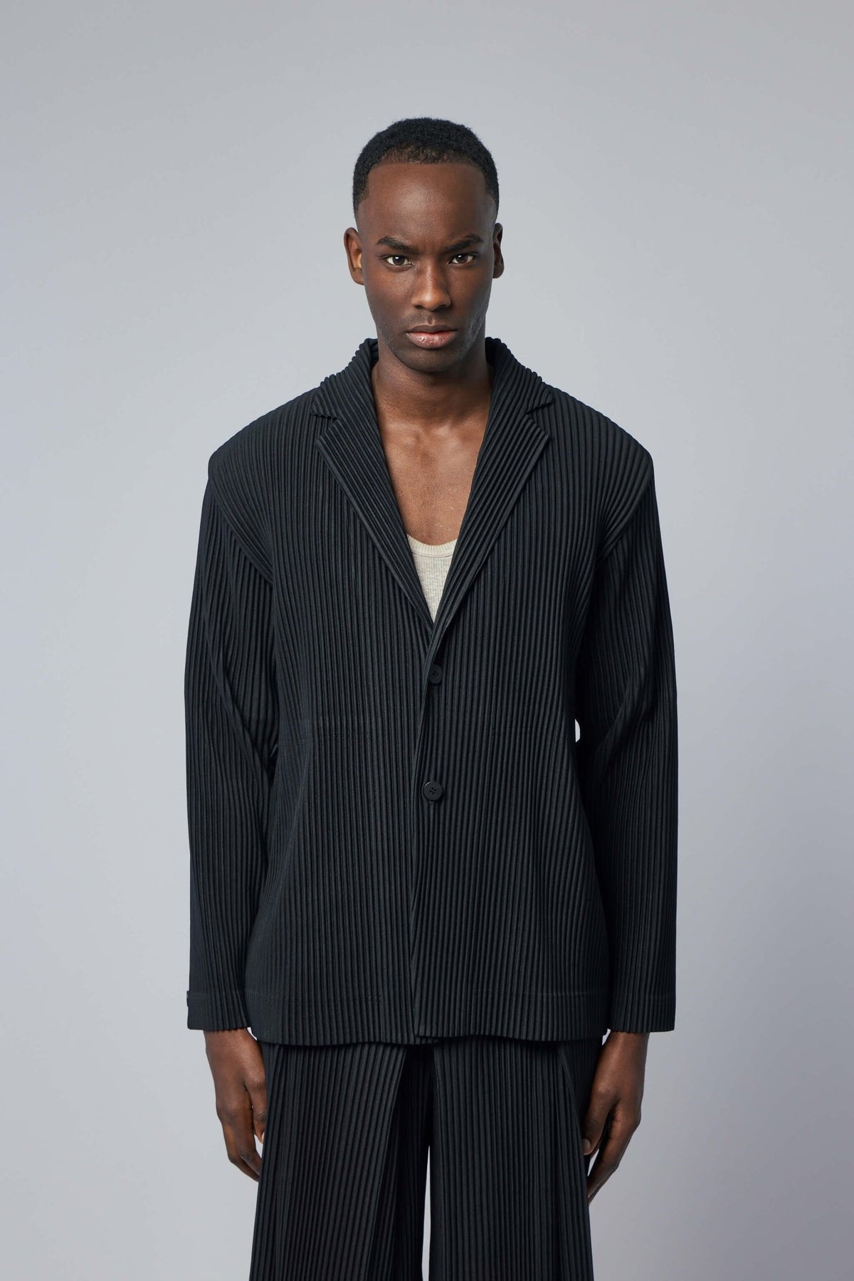 Close-up detail of innovative pleated texture on luxury blazer