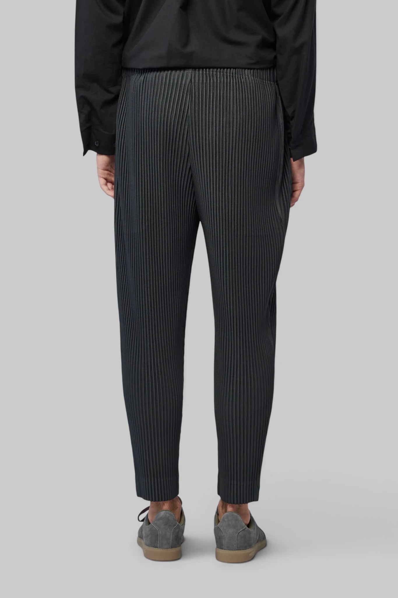 Full-length styling shot of Homme Plissé Issey Miyake Cargo Pants