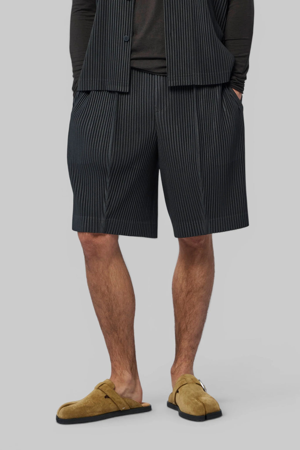 Homme Plissé Issey Miyake Shorts in black pinstripe, front view