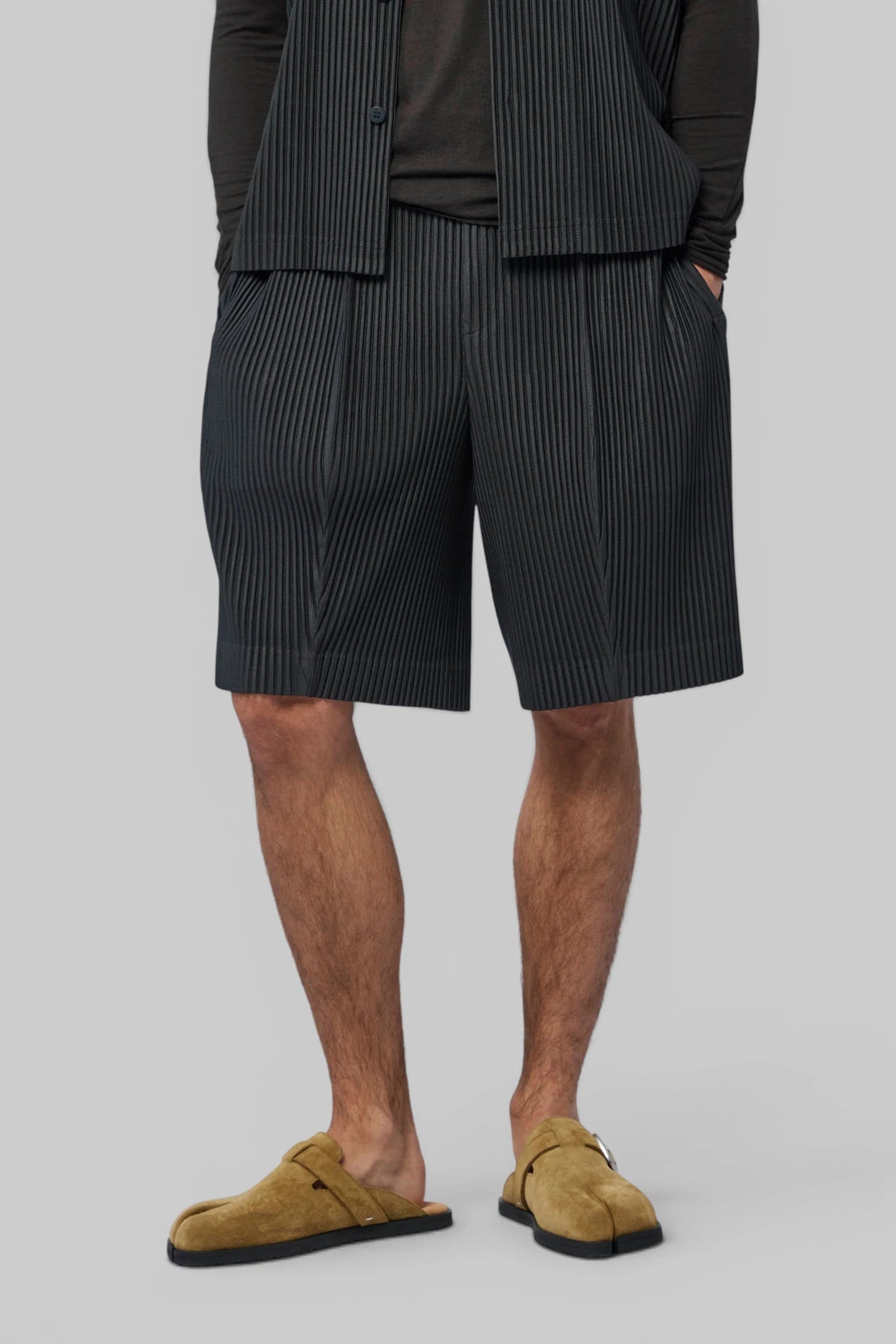 Homme Plissé Issey Miyake Shorts in black pinstripe, front view