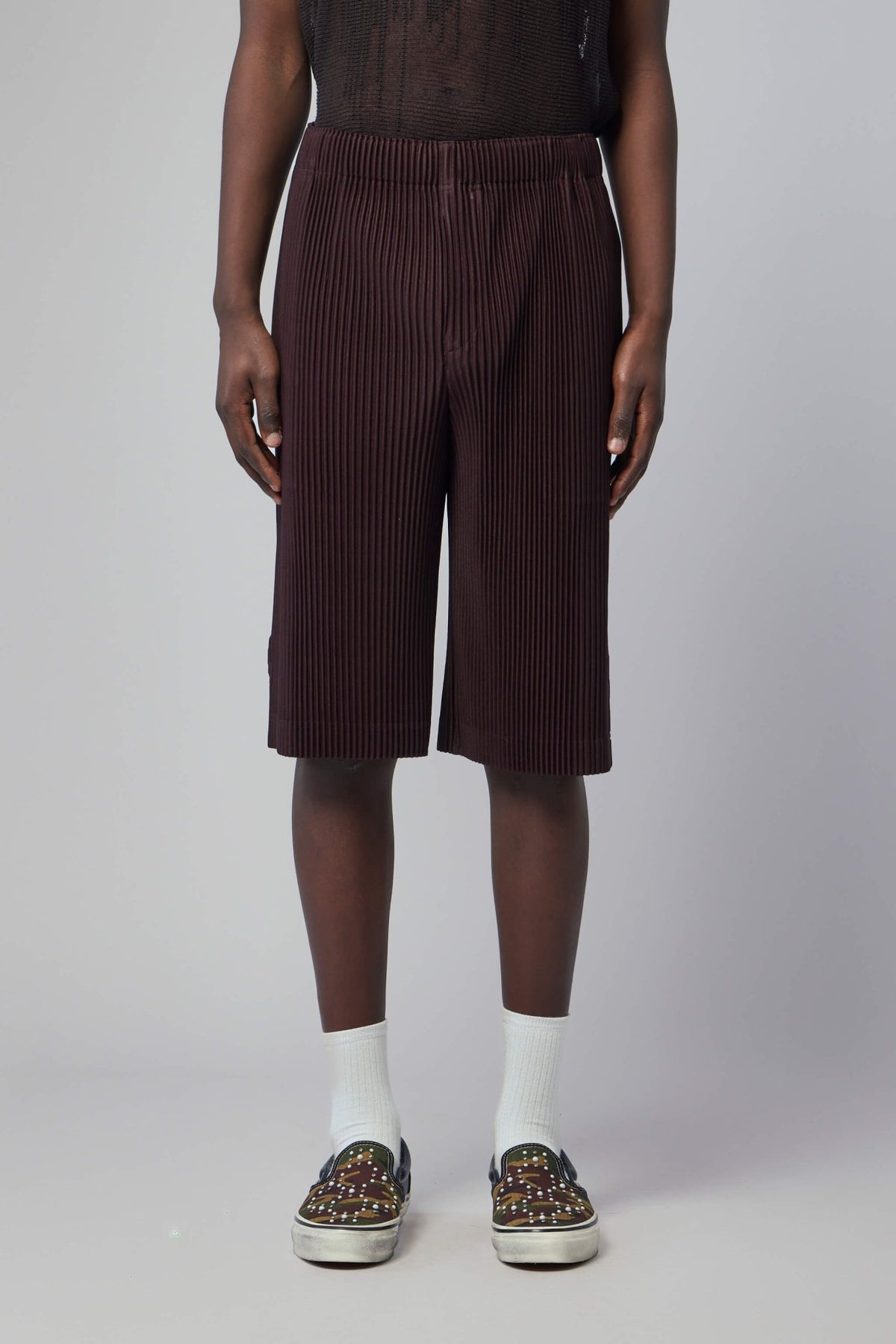 Close-up detail of ribbed texture and button detail on cargo pants