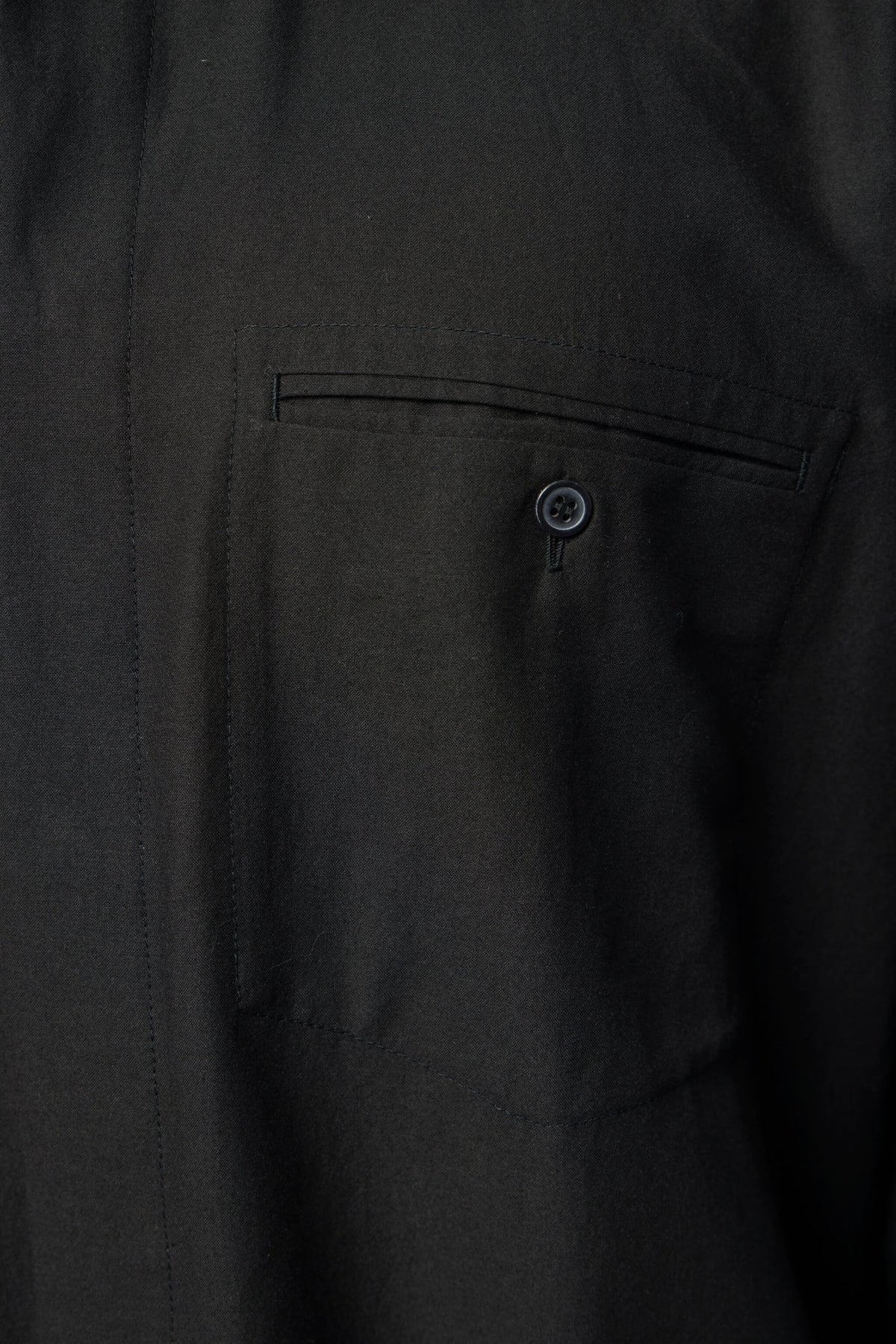 Side view showing relaxed fit and long sleeve design