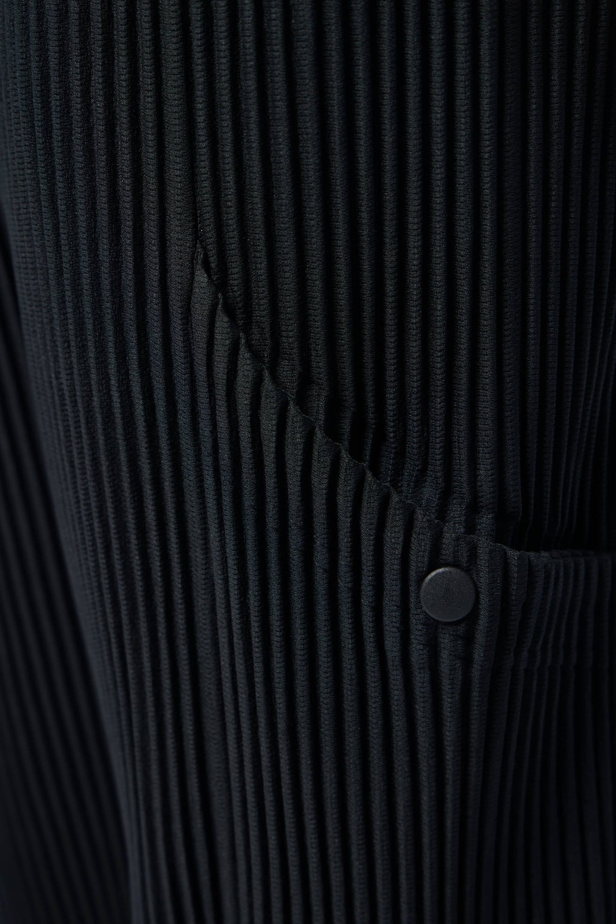 Detail shot of front and side pockets on Issey Miyake cargo pants