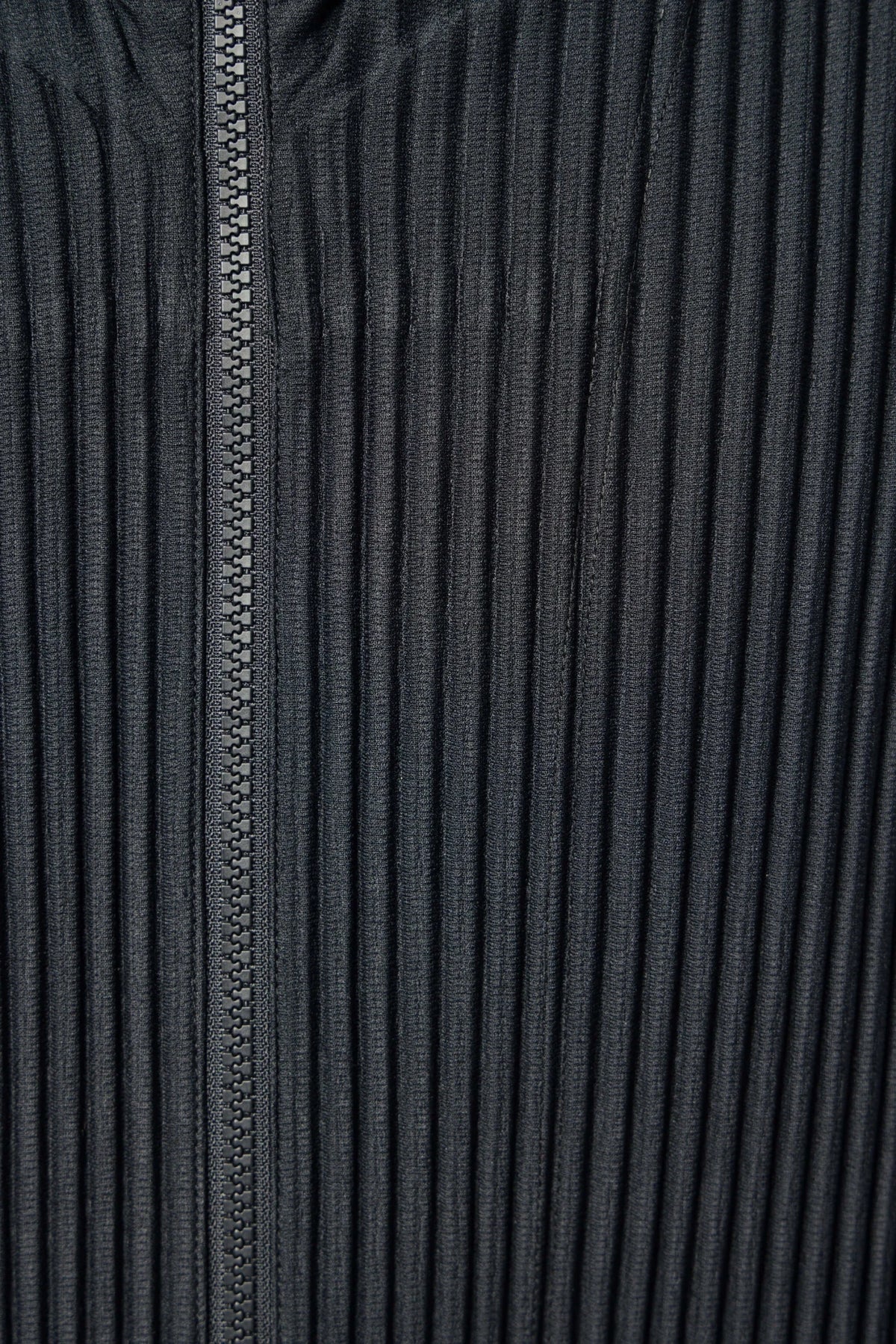 Homme Plissé Issey Miyake Zip-Ups cardigan laid flat to showcase silhouette